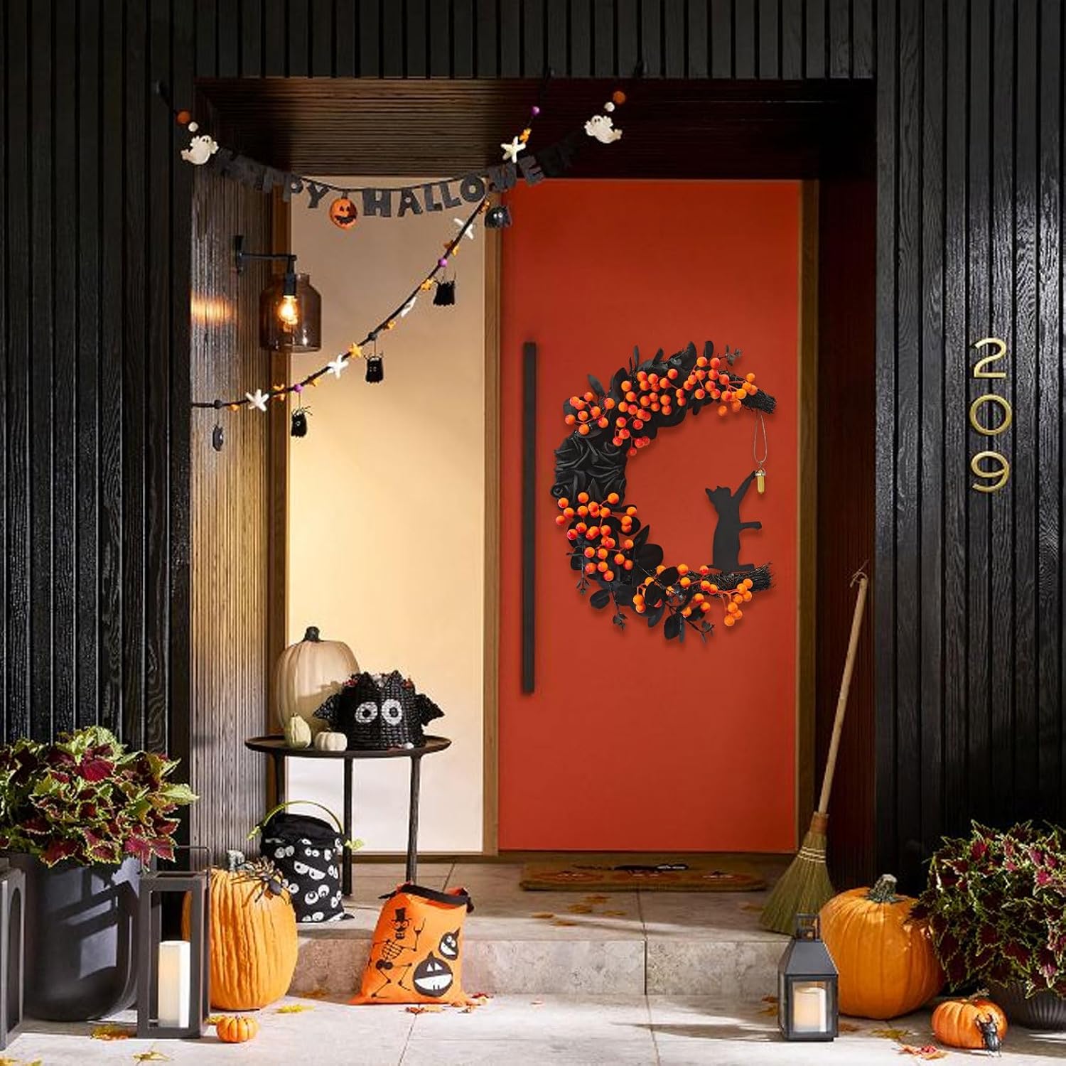 Cat moon wreath on a promotional orange-door backdrop