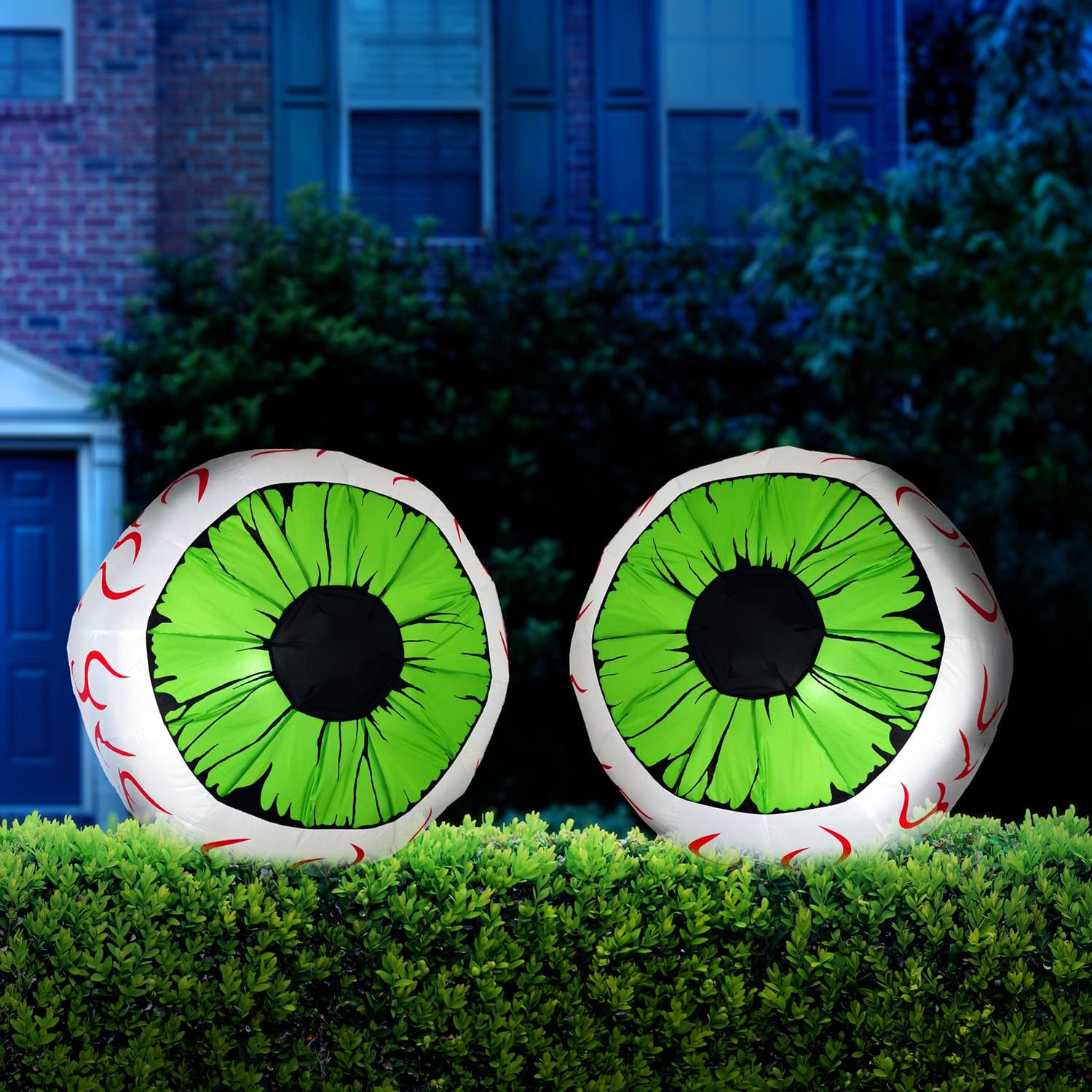 Joiedomi pair of green inflatable eyes in a promotional yard