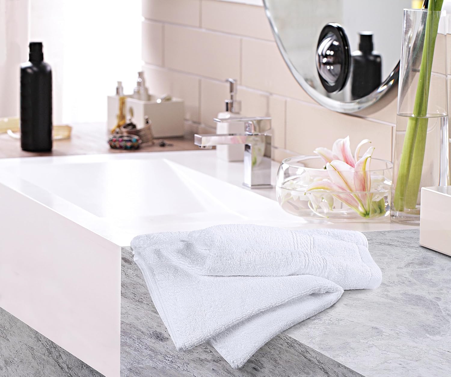 Utopia white towels beside separate bathroom styling props