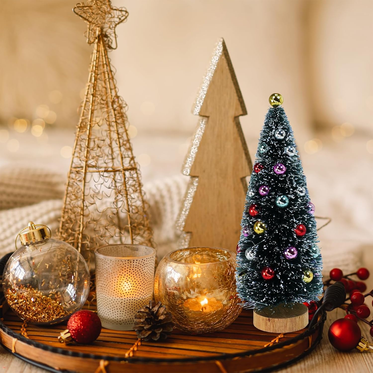 Miniature tree beside separate tray and candle props