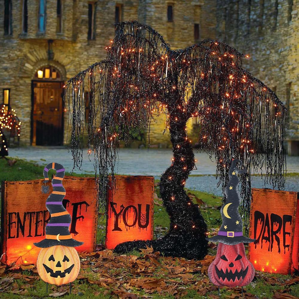 Pumpkin stakes in a large Halloween yard scene