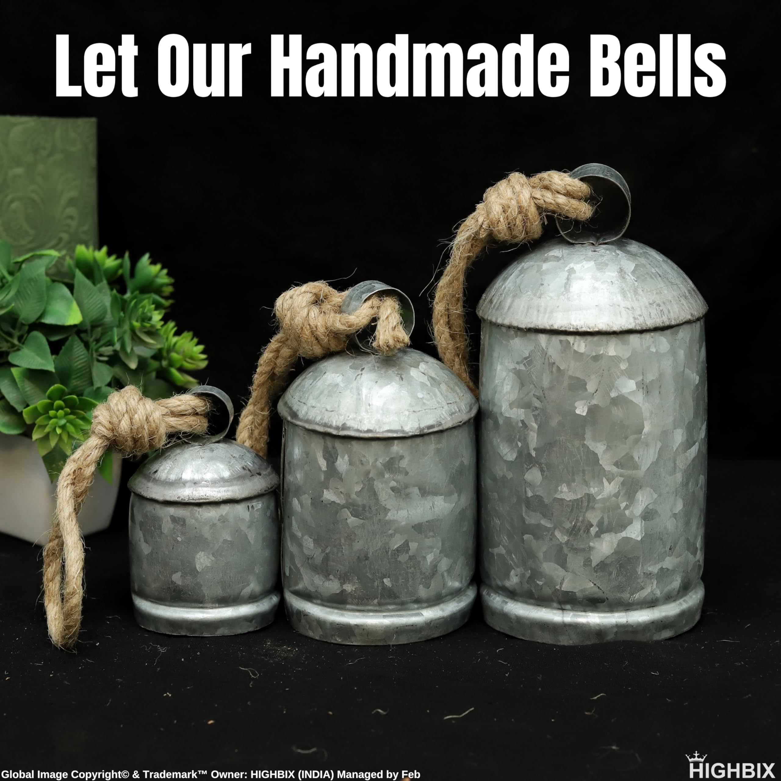 Three galvanized bells standing together
