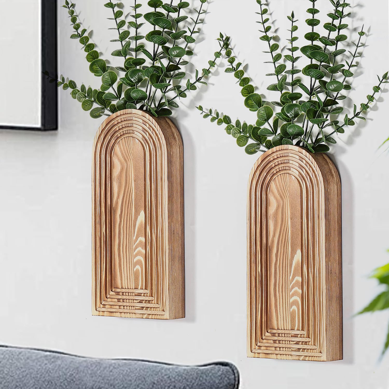 Pair of brown arched Dnnnii wall pockets with supplier styling greenery