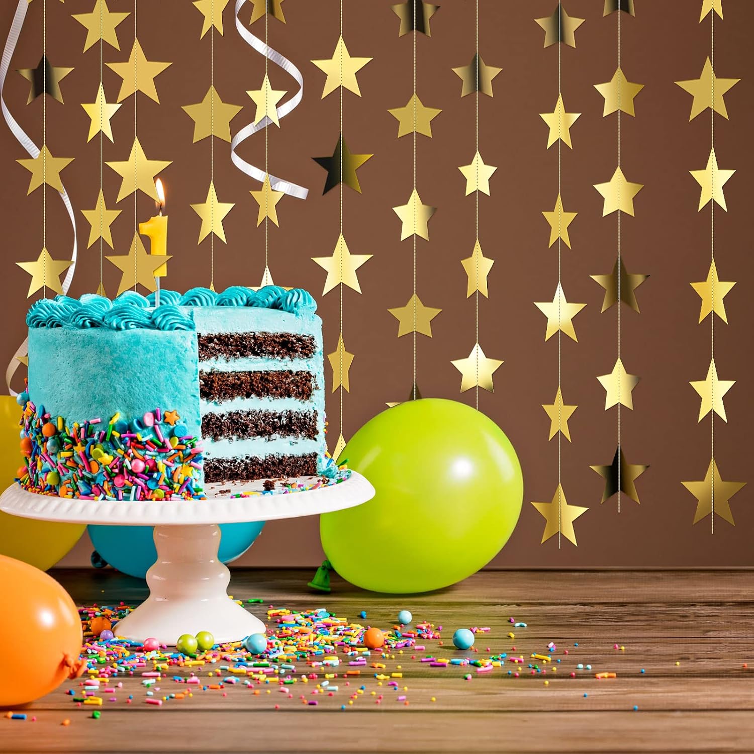Patelai gold stars beside separately supplied cake props