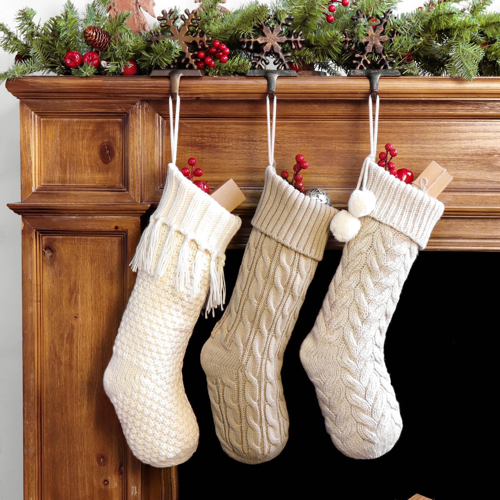 Three white and beige LimBridge knit stockings in different knit patterns