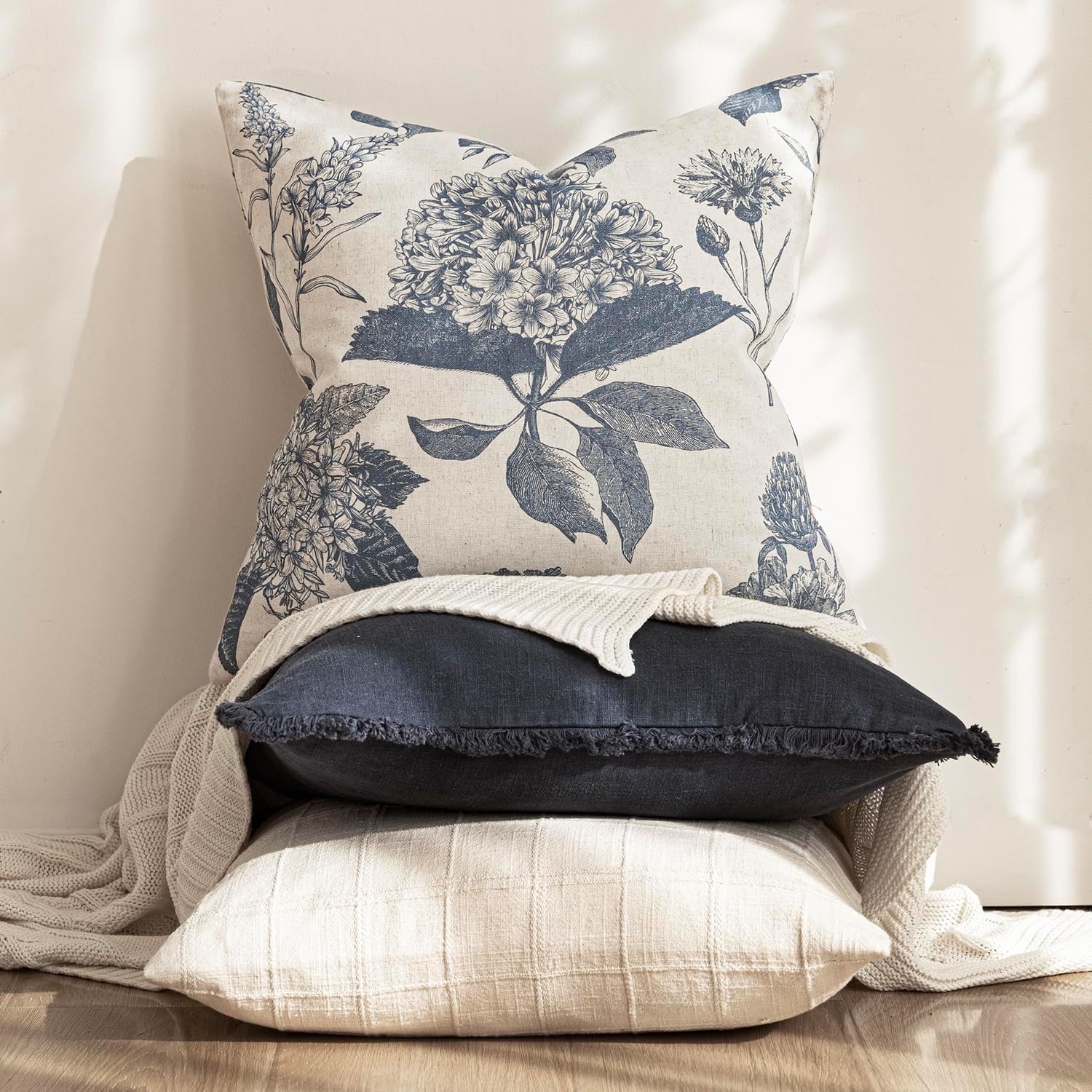 Foindtower blue floral cover in a layered cushion scene