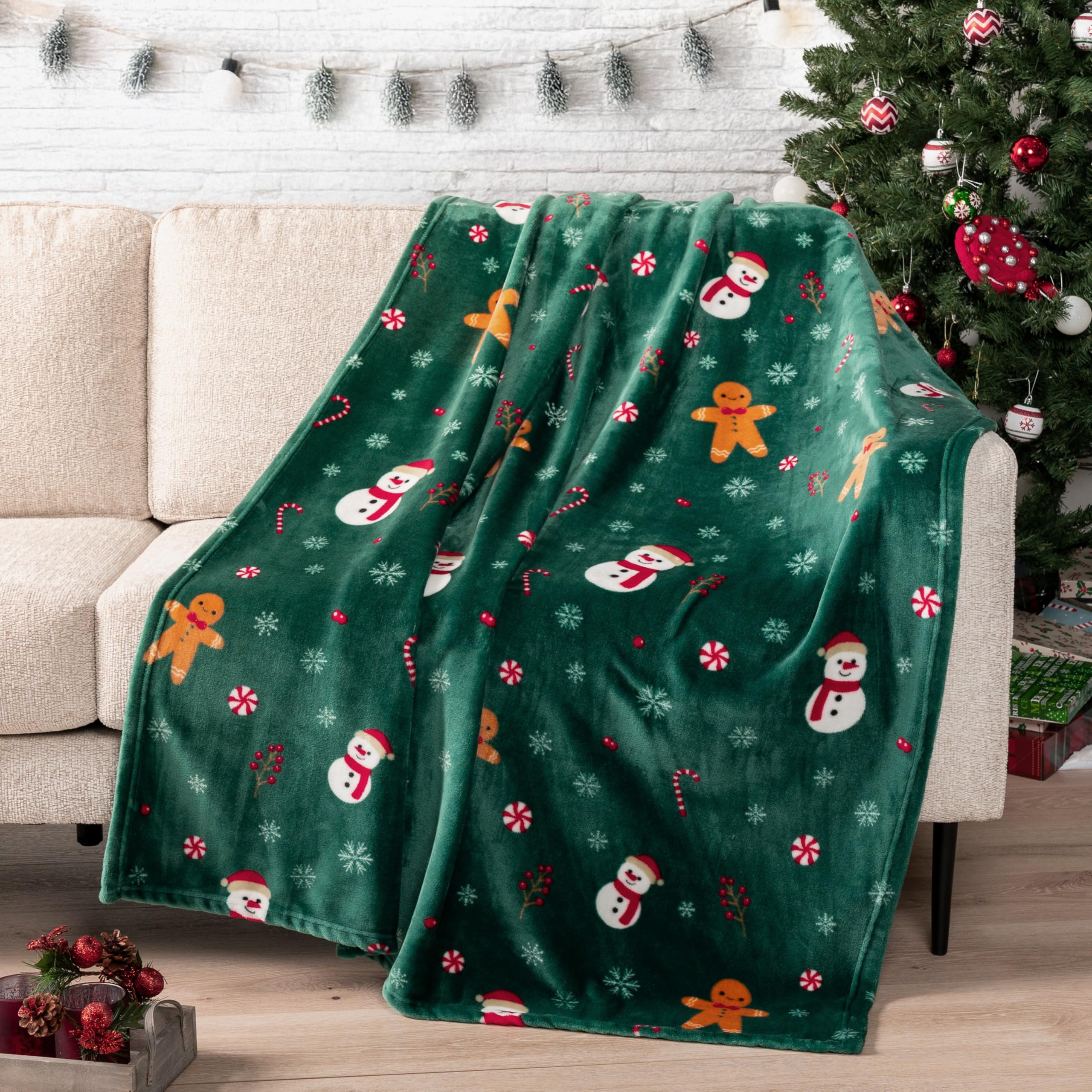 Green gingerbread fleece throw draped over a sofa