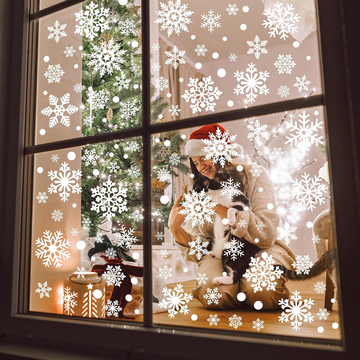 Traplace snowflake clings in a Christmas window scene