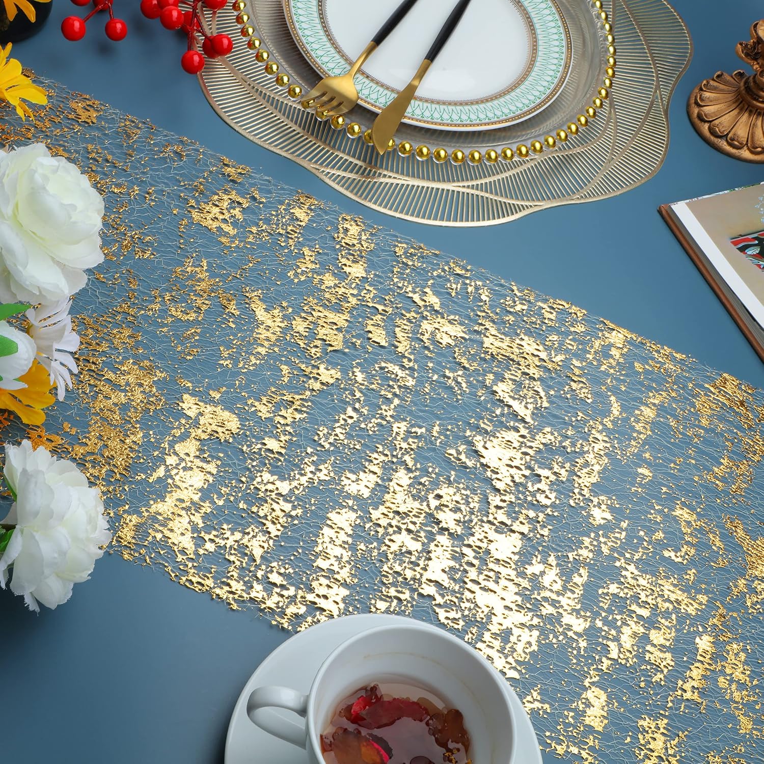 Gold mesh runner beneath tableware in a promotional scene
