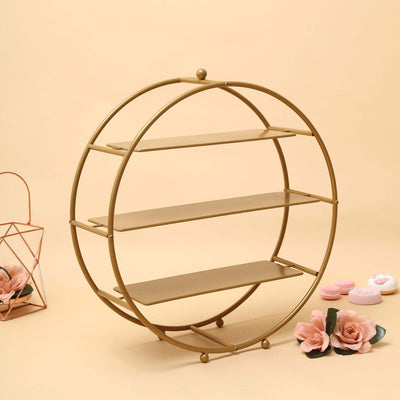 Bare gold wheel frame and shelves with nearby styling props