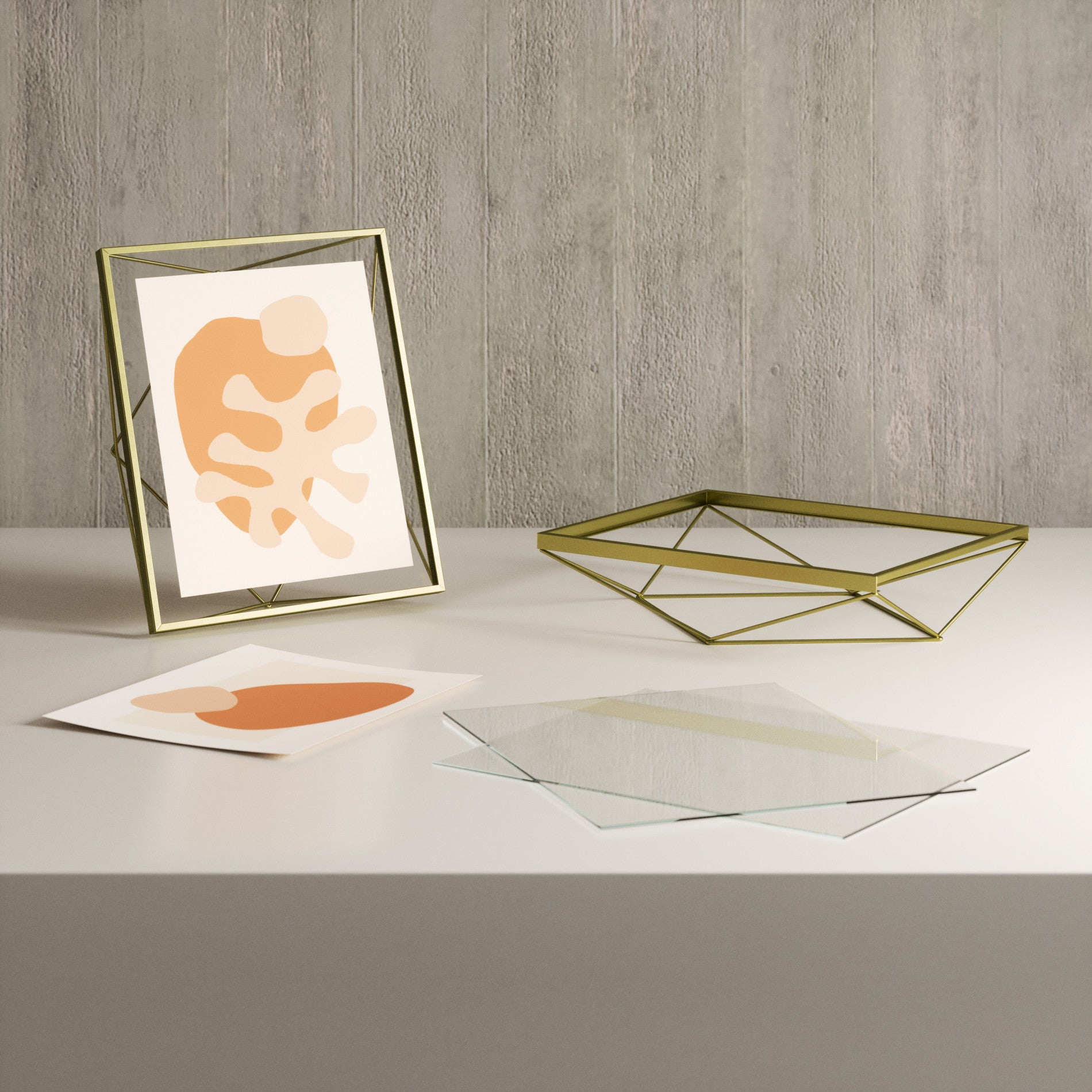 Matte-Brass Prisma frame with separate glass panes shown in the supplier gallery