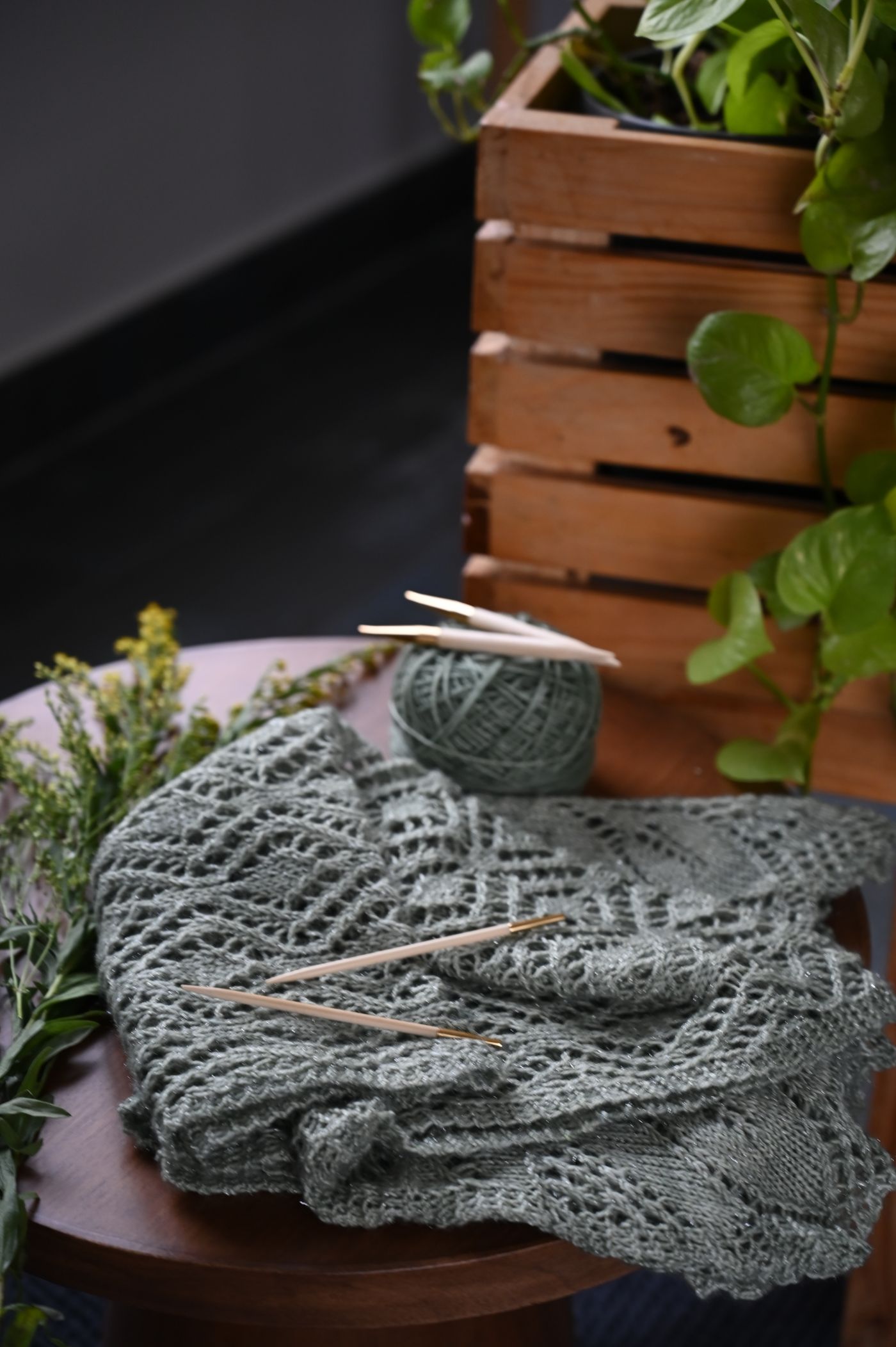 A partly worked textile beside its remaining yarn