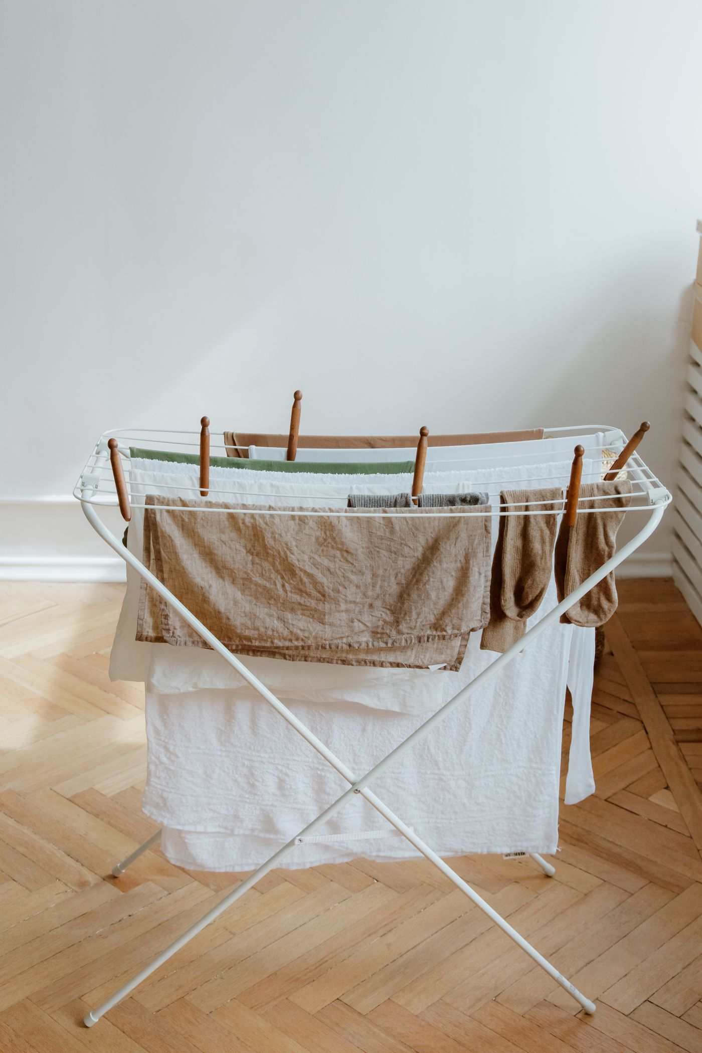 Laundry hanging on an indoor folding rack