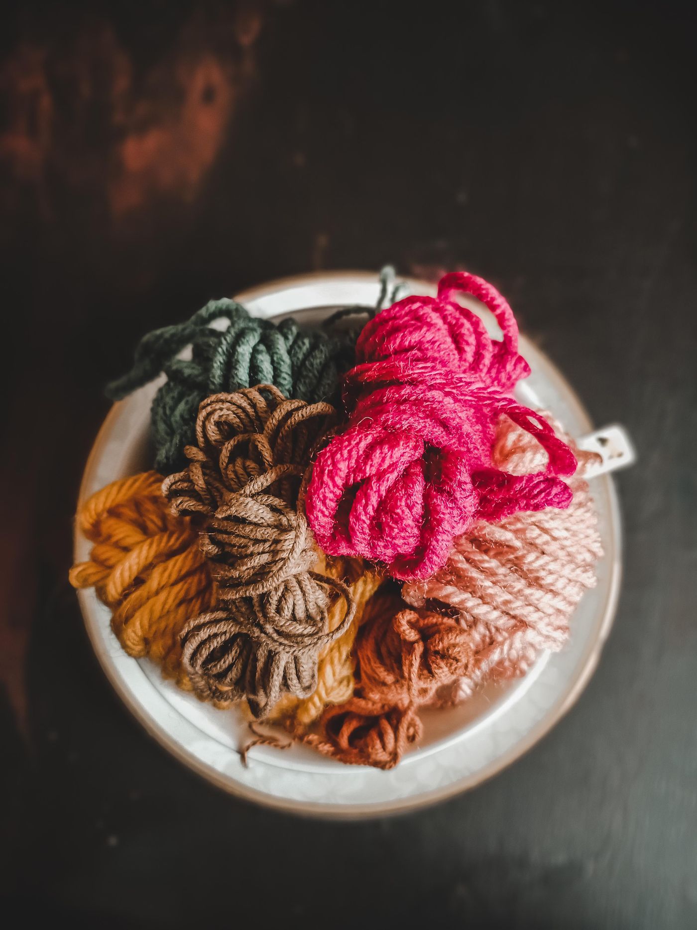 Several yarn colors collected in one cup