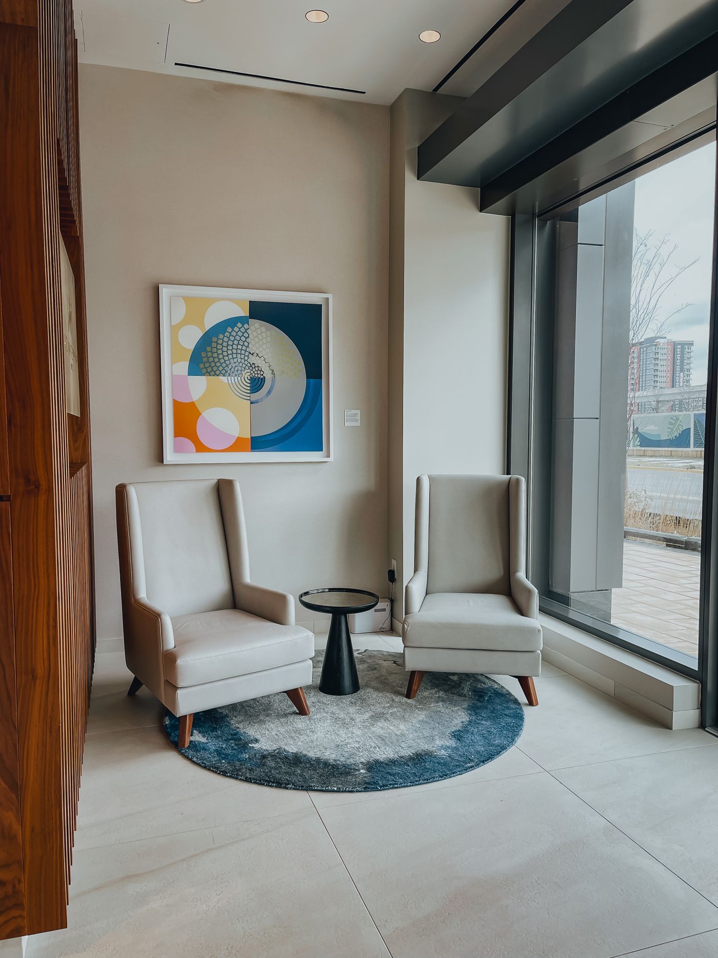 Two occasional chairs arranged near a window