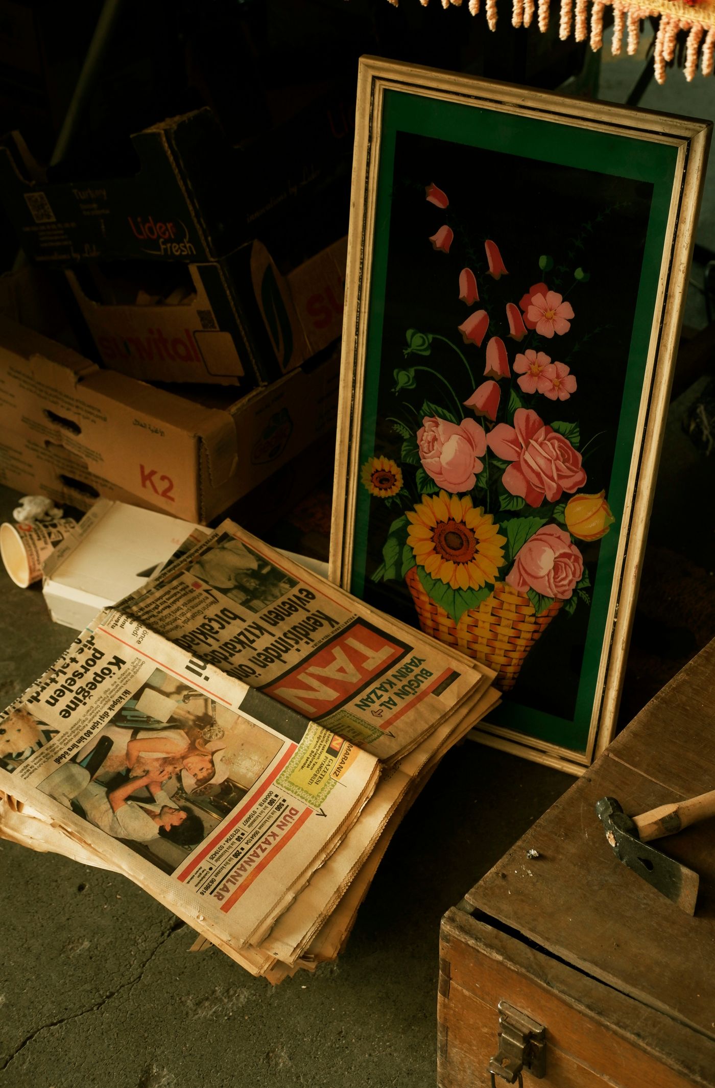 A framed picture and books among secondhand finds
