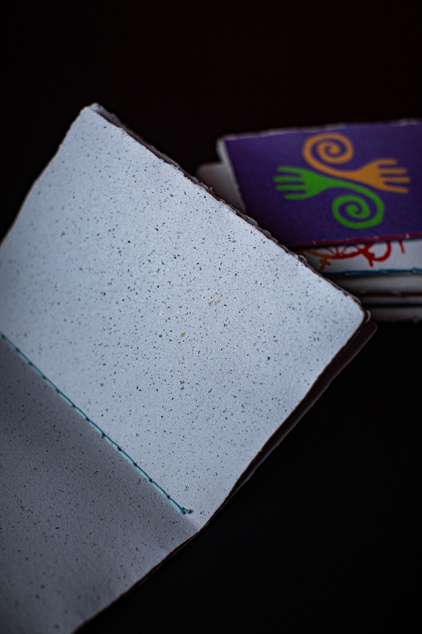 Open handmade-looking notebook with textured blank pages; page-planning context