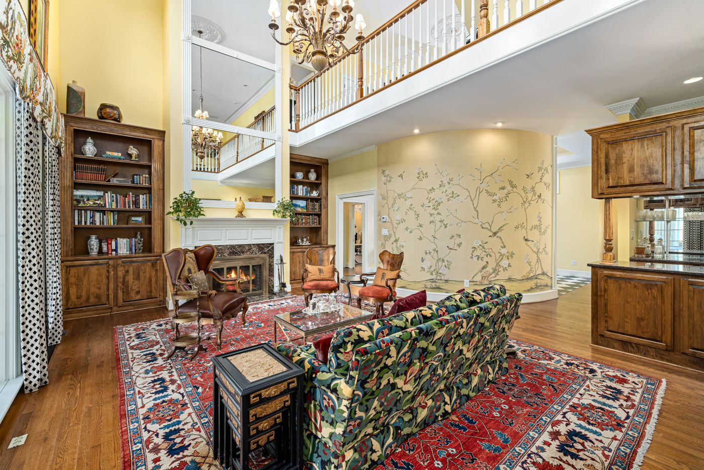 Patterned seating and an ornate rug in a large room; pattern-relationship example