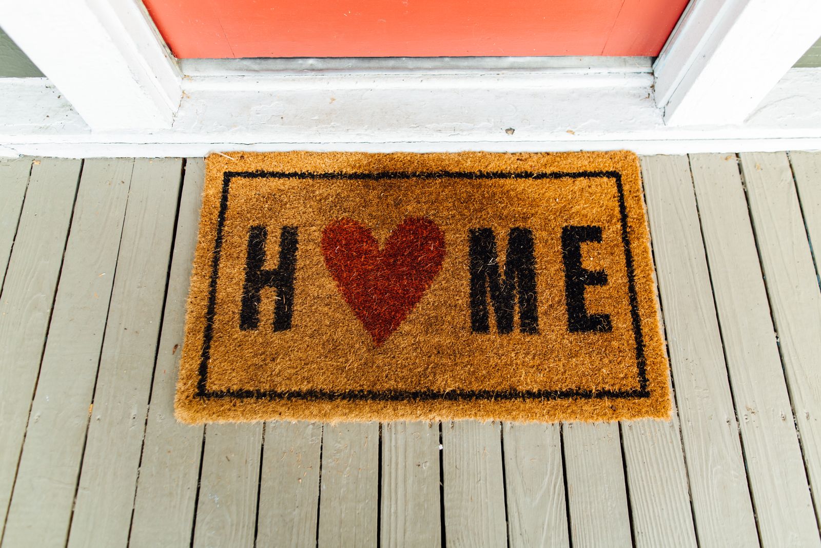Coir-style Home doormat on wooden flooring