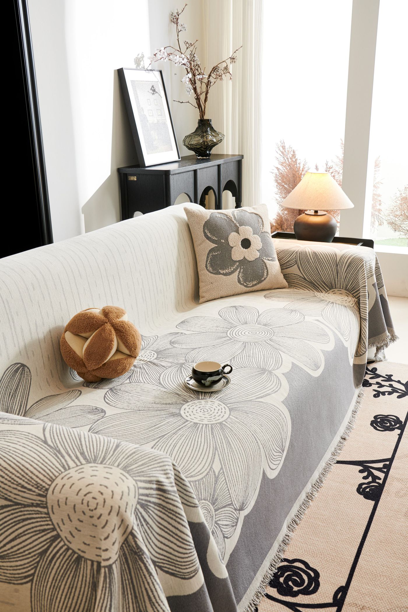 Floral-covered sofa with separate decorative cushions