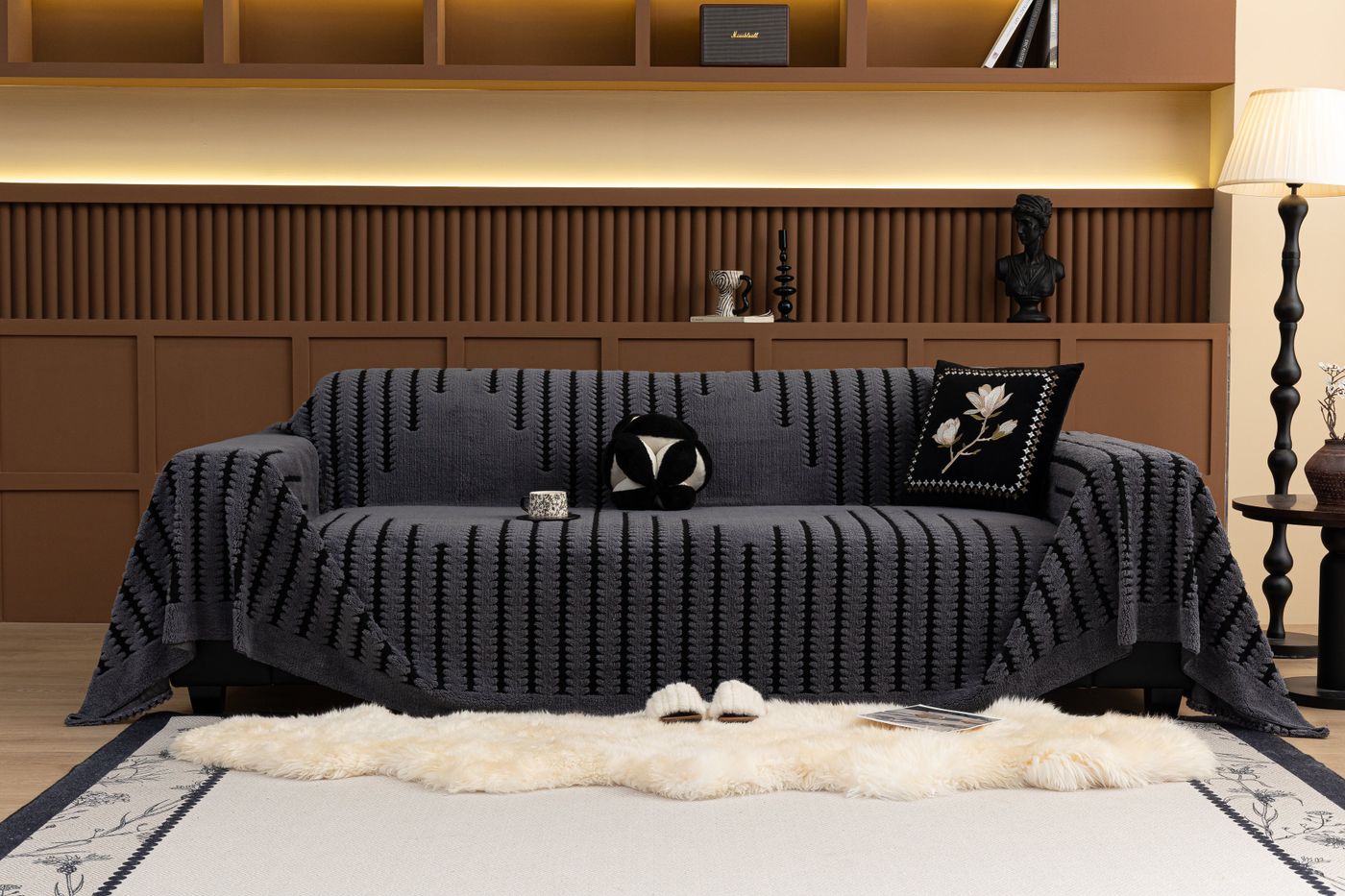 Blue checked sofa cover with contrasting cushions