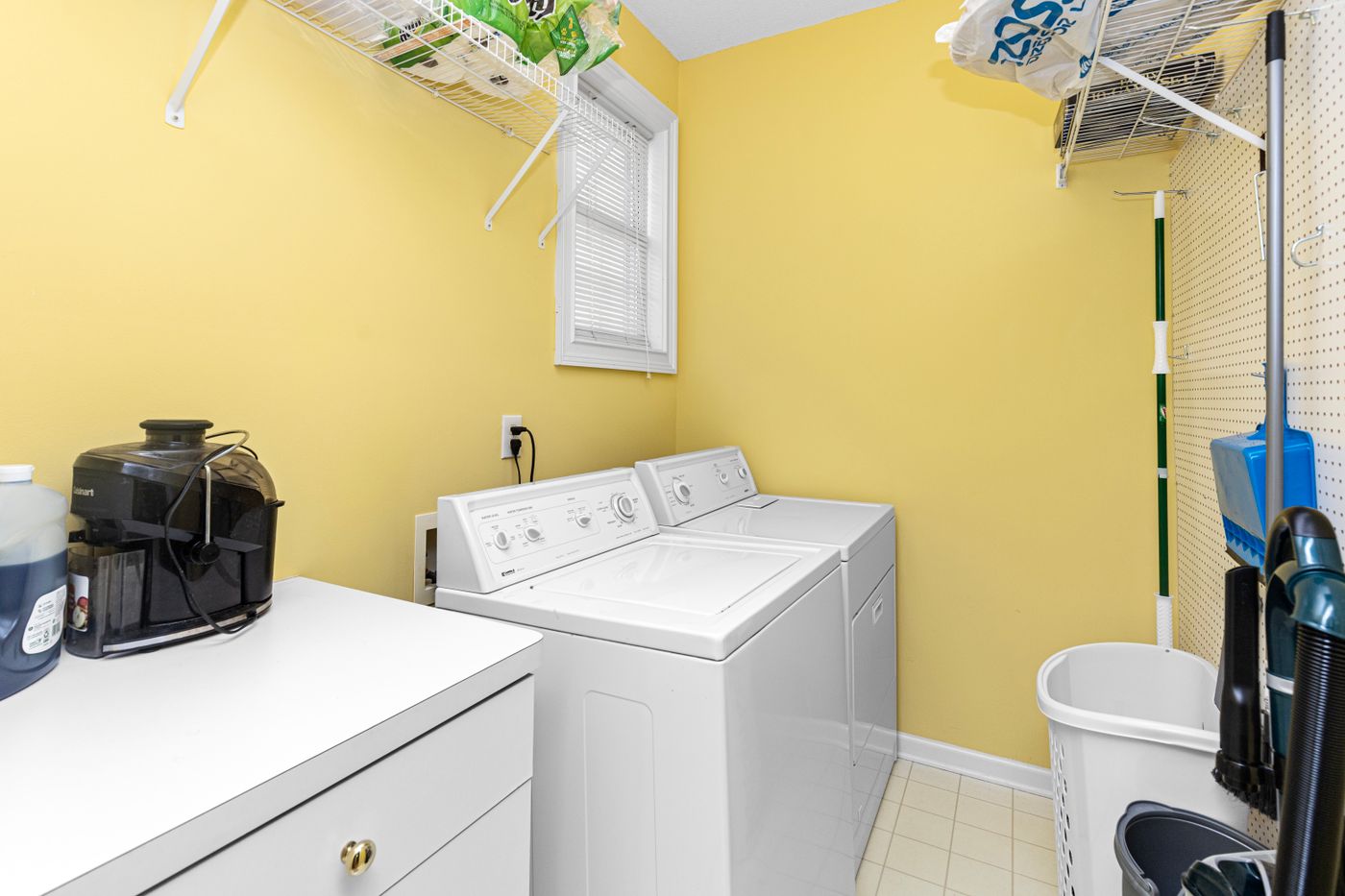 A home laundry area with clear floor space and washing appliances