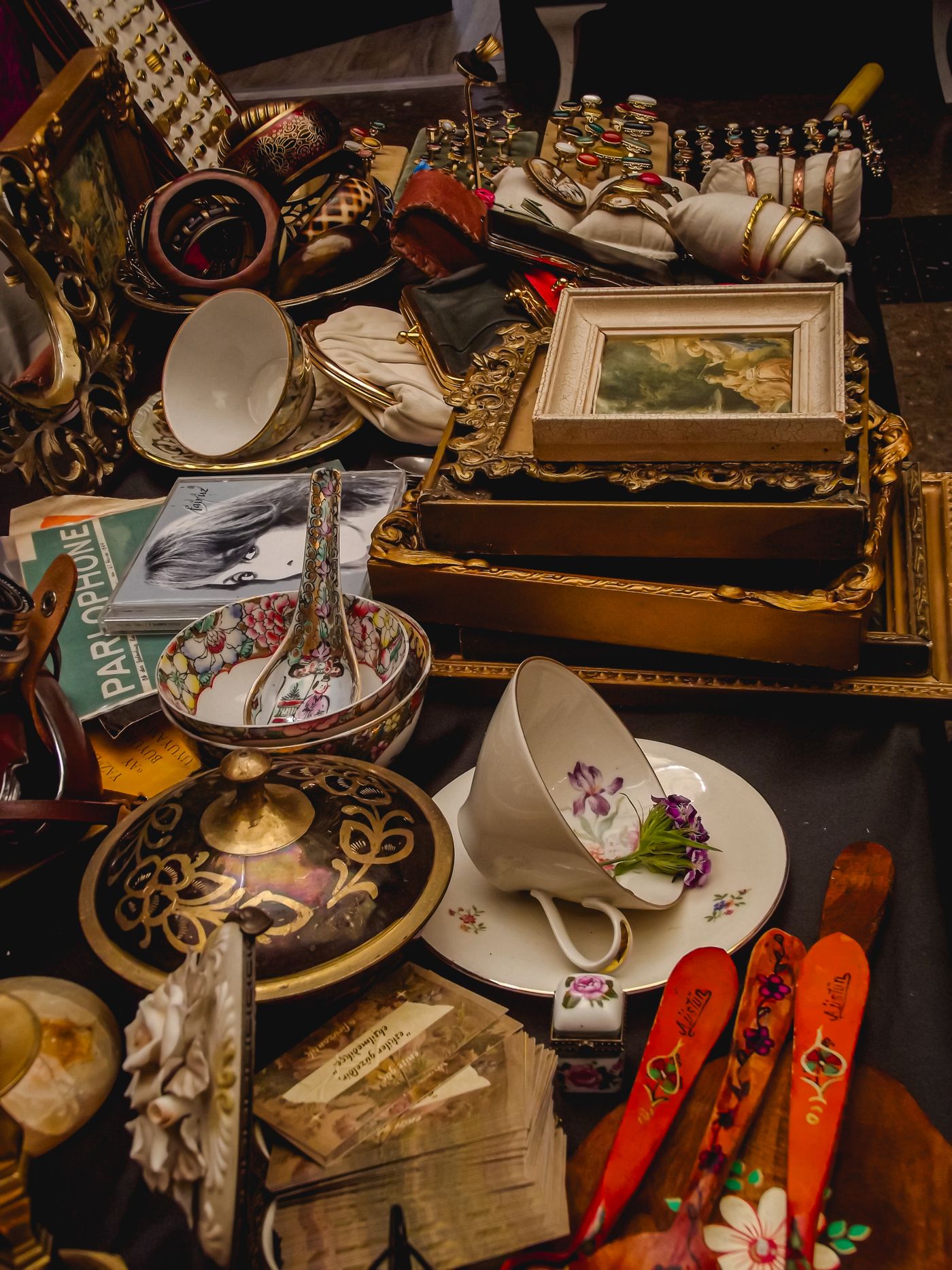 Mixed vintage decorative pieces arranged for inspection