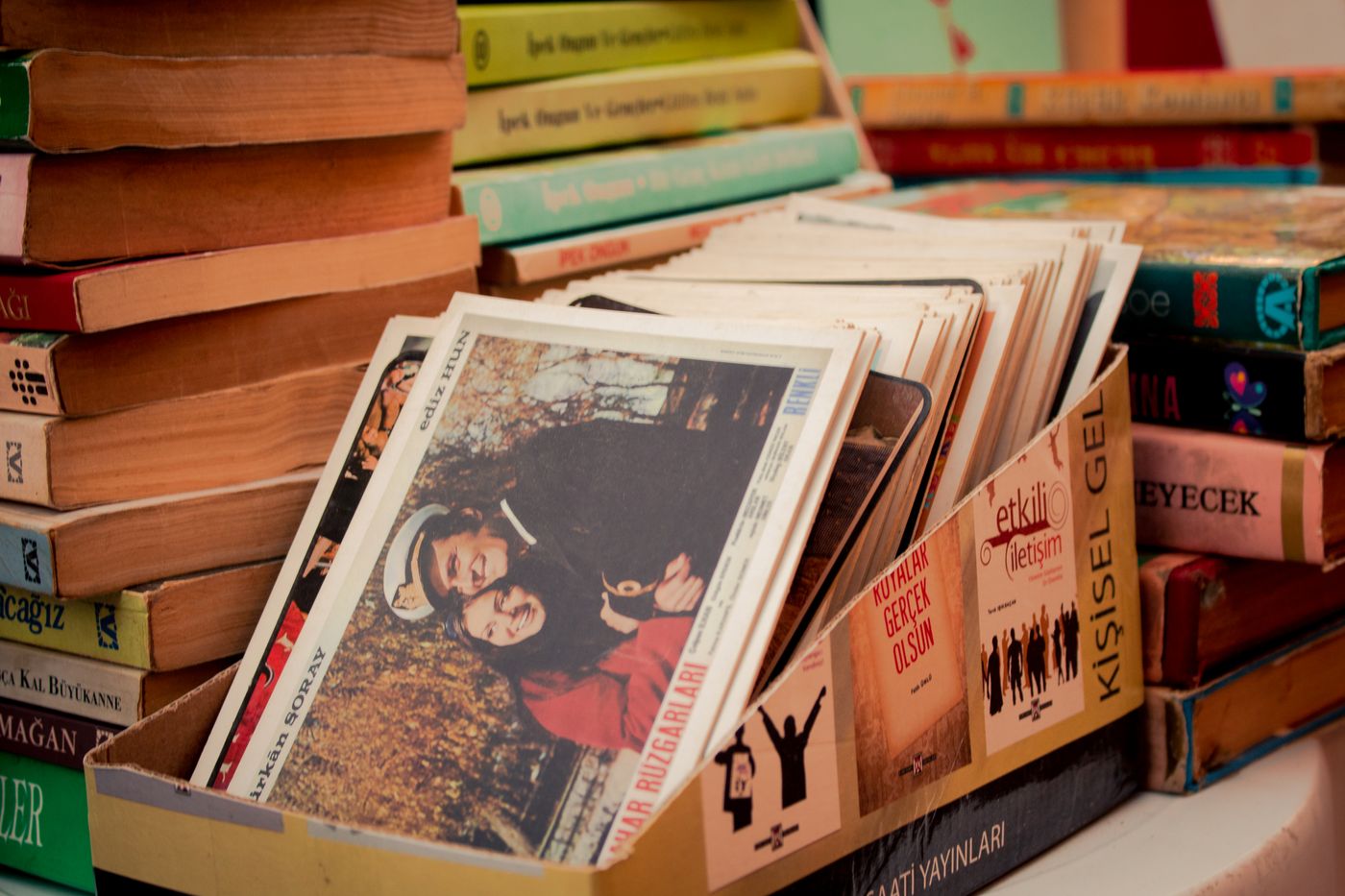 Postcards displayed upright in a browsing box