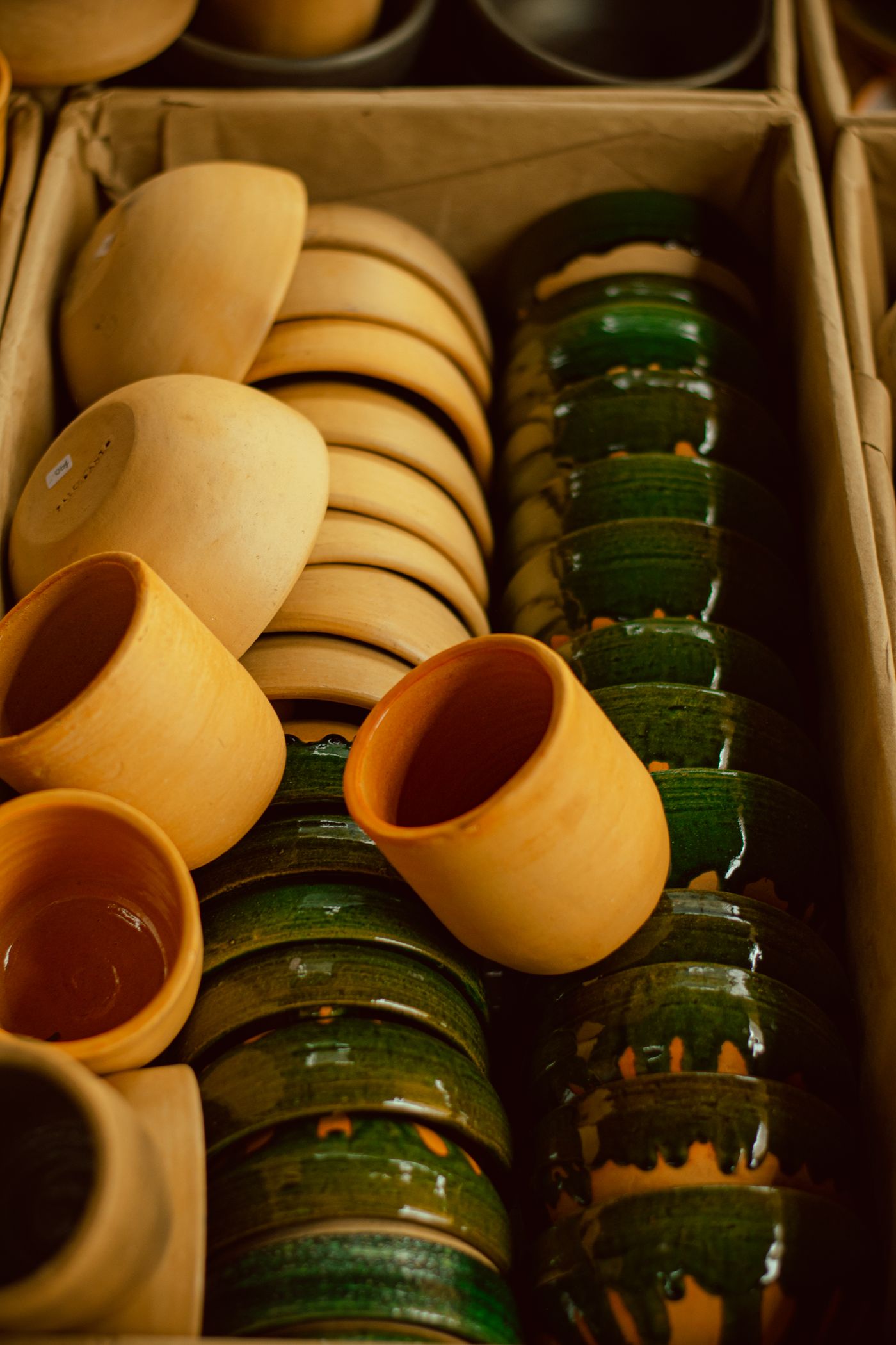 Ceramic cups and vessels contained together for storage