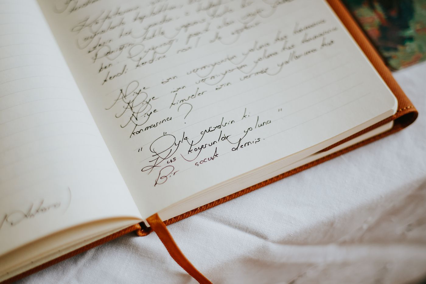 A close view of an open handwritten notebook
