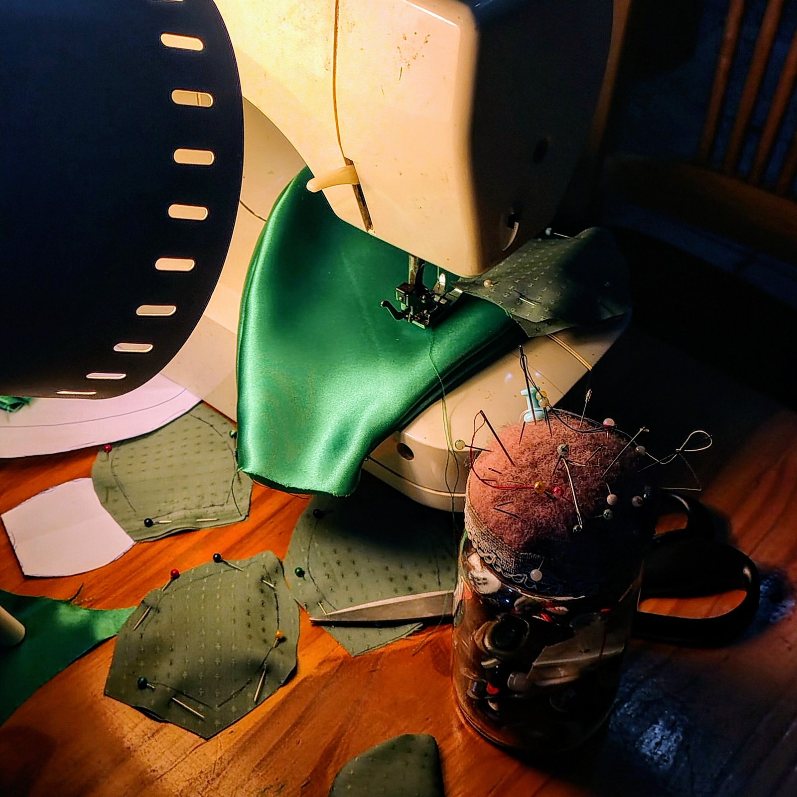 Fabric and sewing tools beside a sewing machine