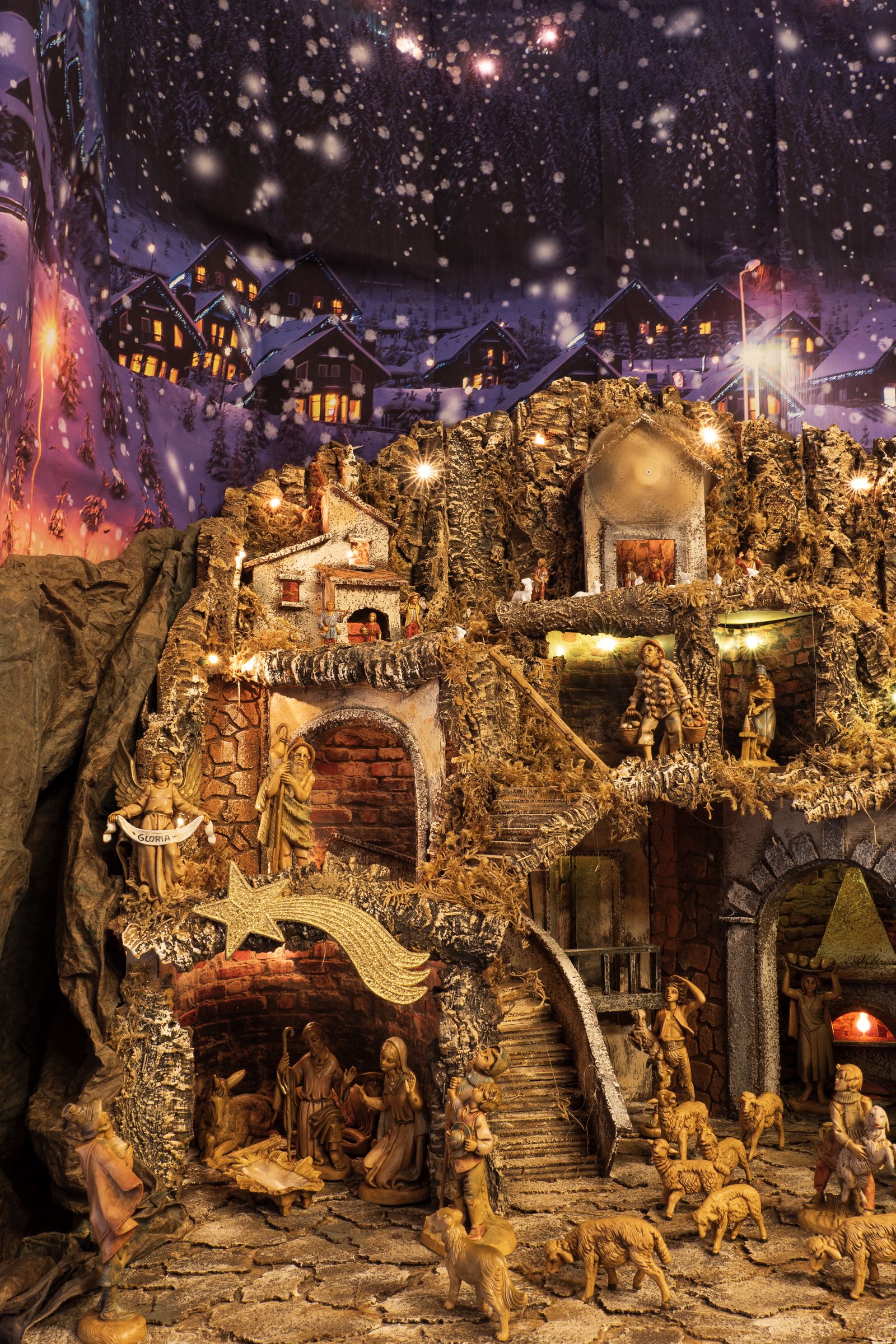 A separate detailed nativity display against a starry backdrop