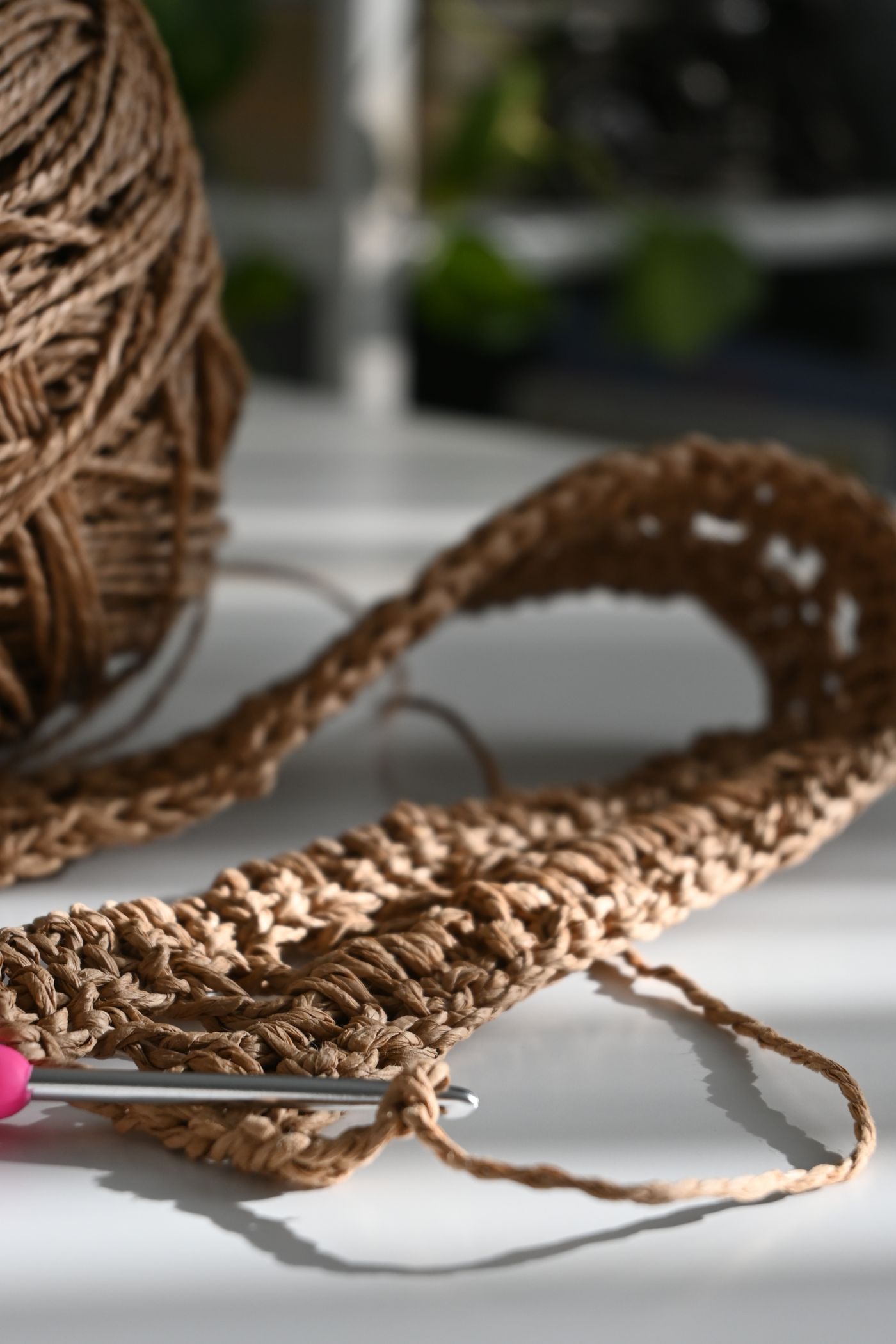 An active crochet piece connected to its working yarn