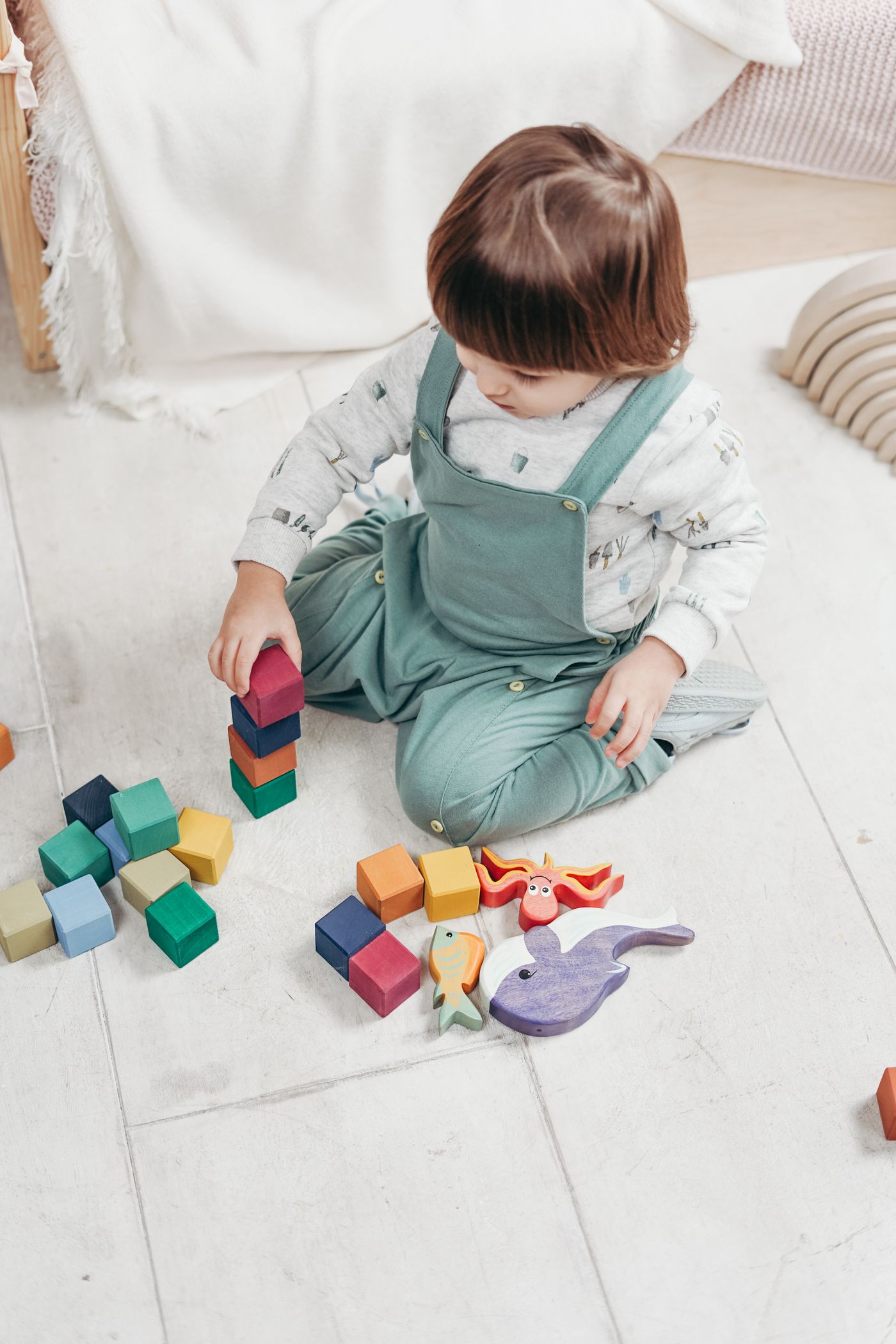 Child using colored blocks during object play
