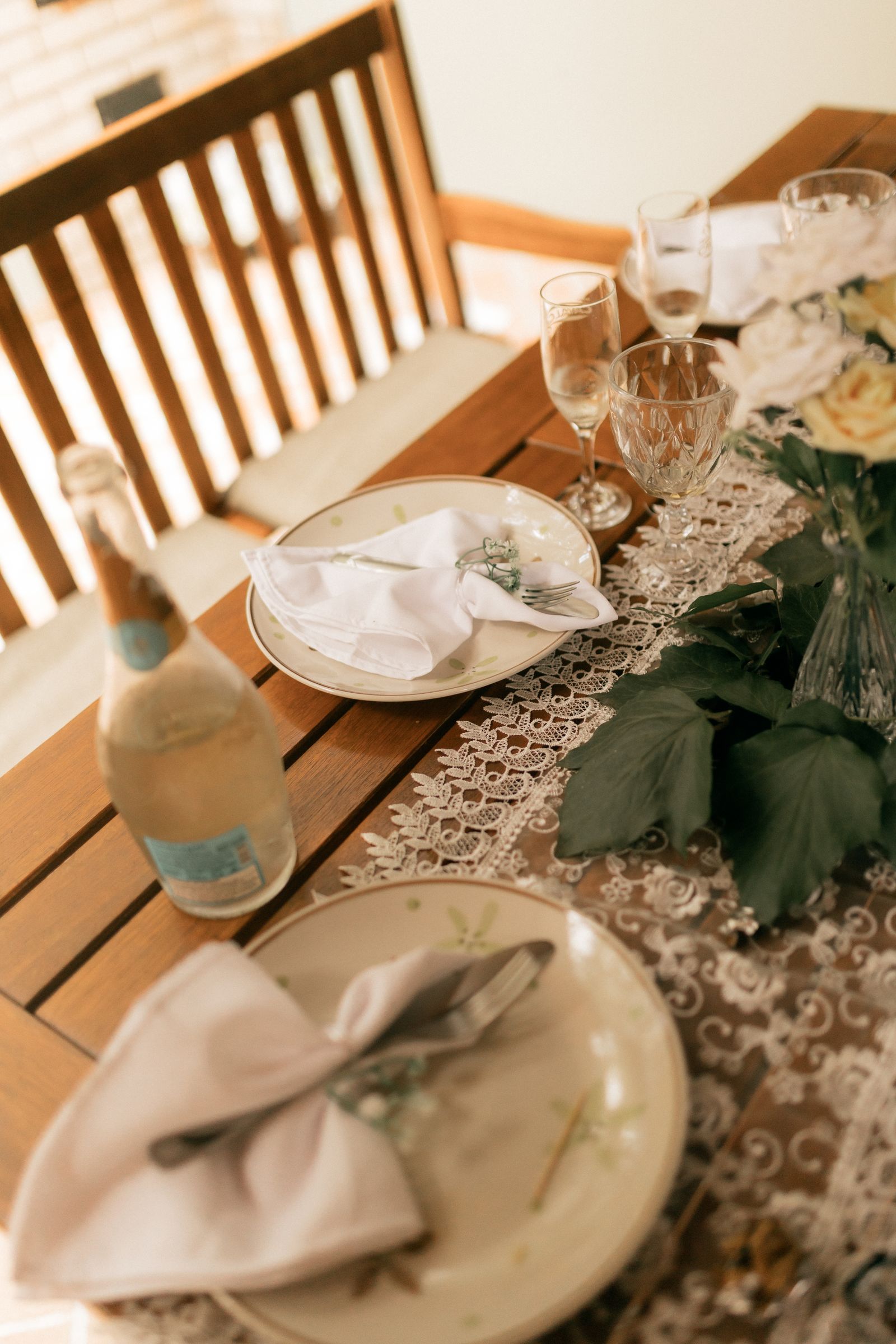 A lace runner beneath an arranged dining-table setting