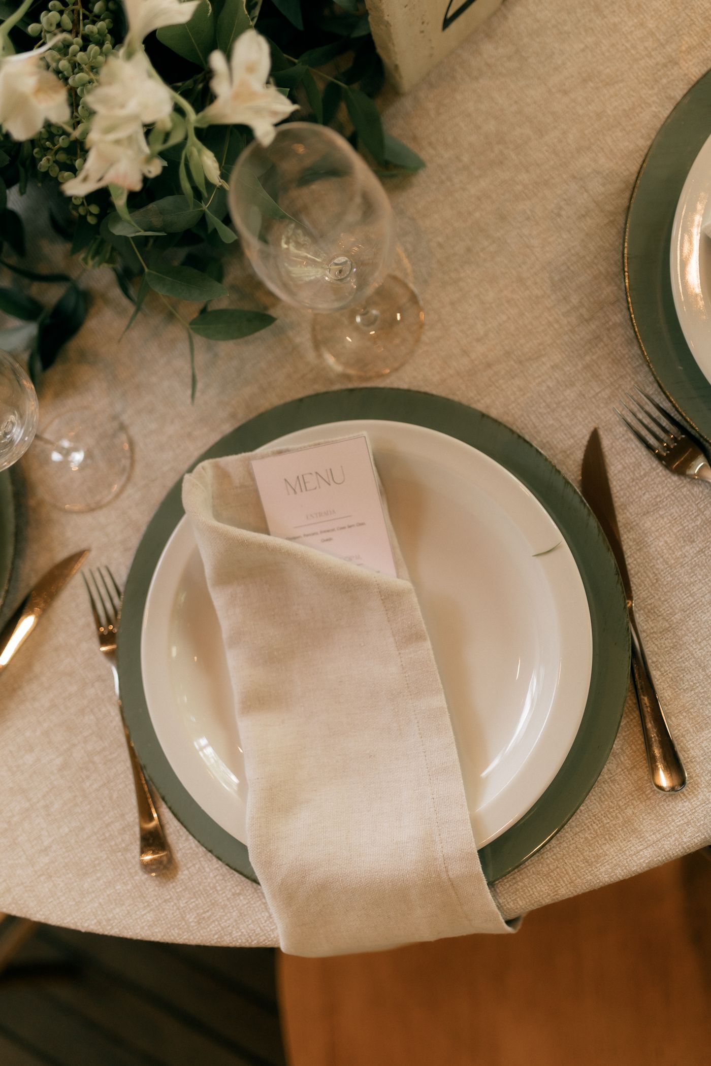 A simple folded place card beside a plate