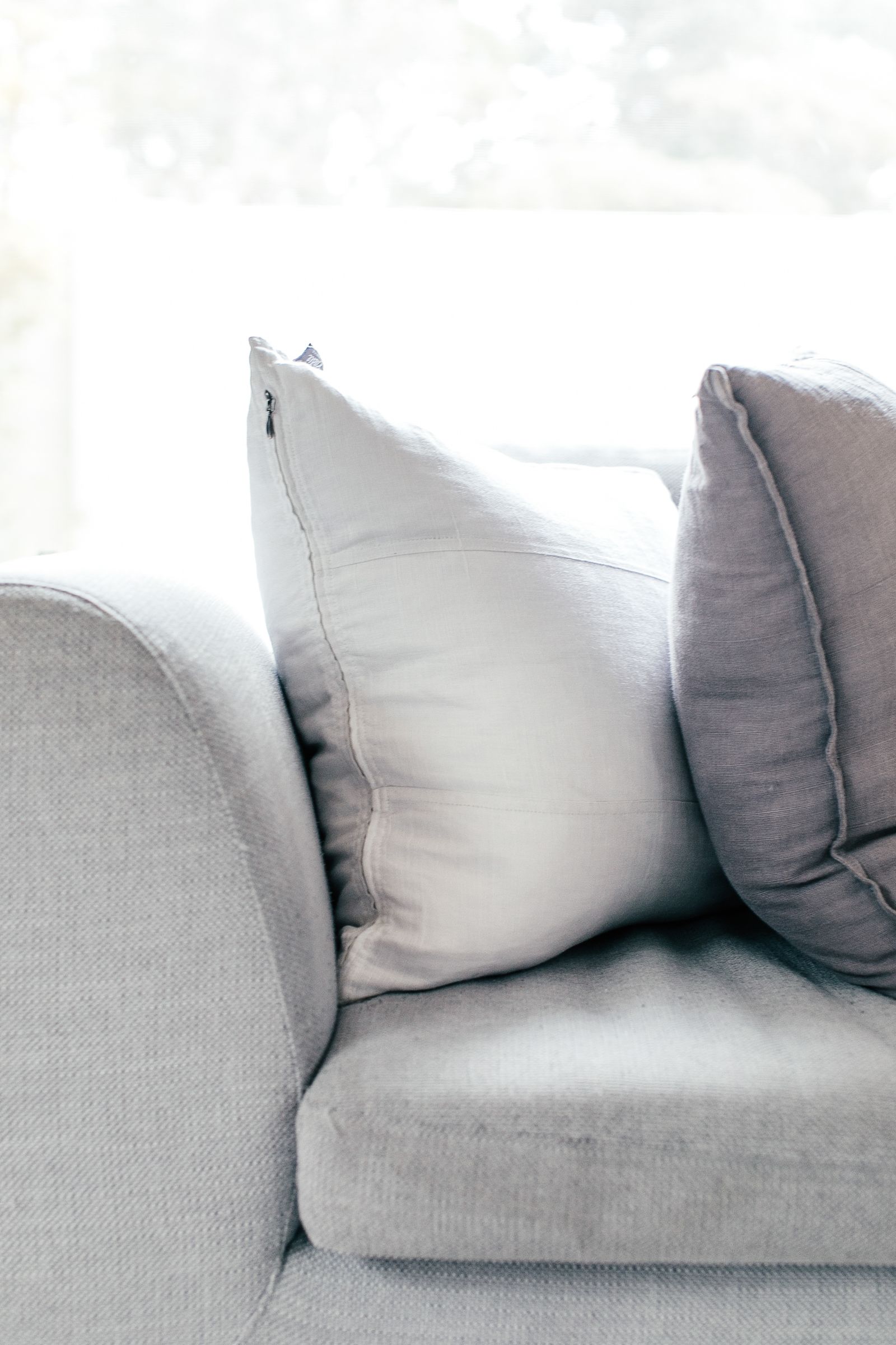 Pale throw cushions on a pale sofa