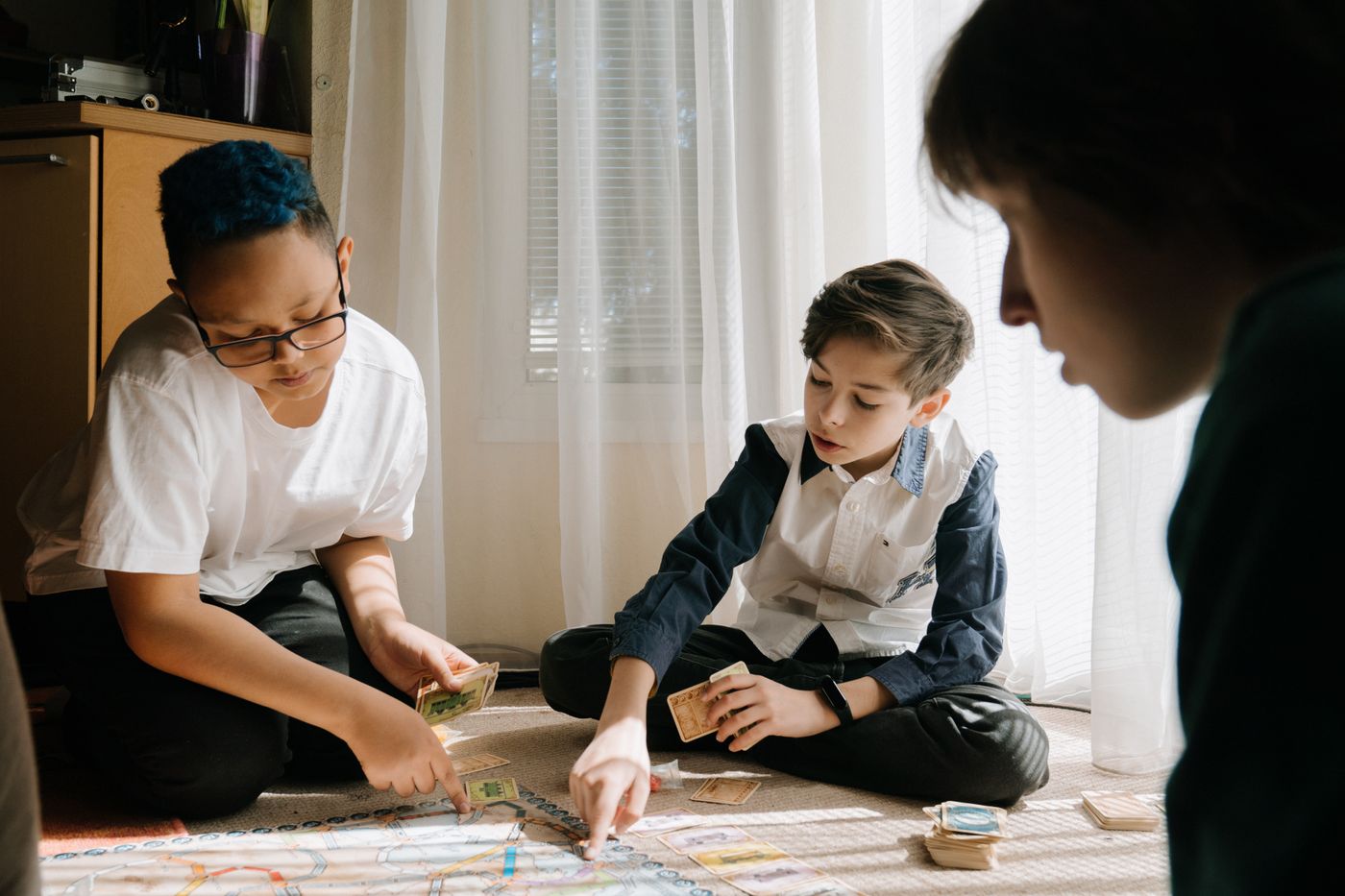 Adult and child playing a tabletop game together
