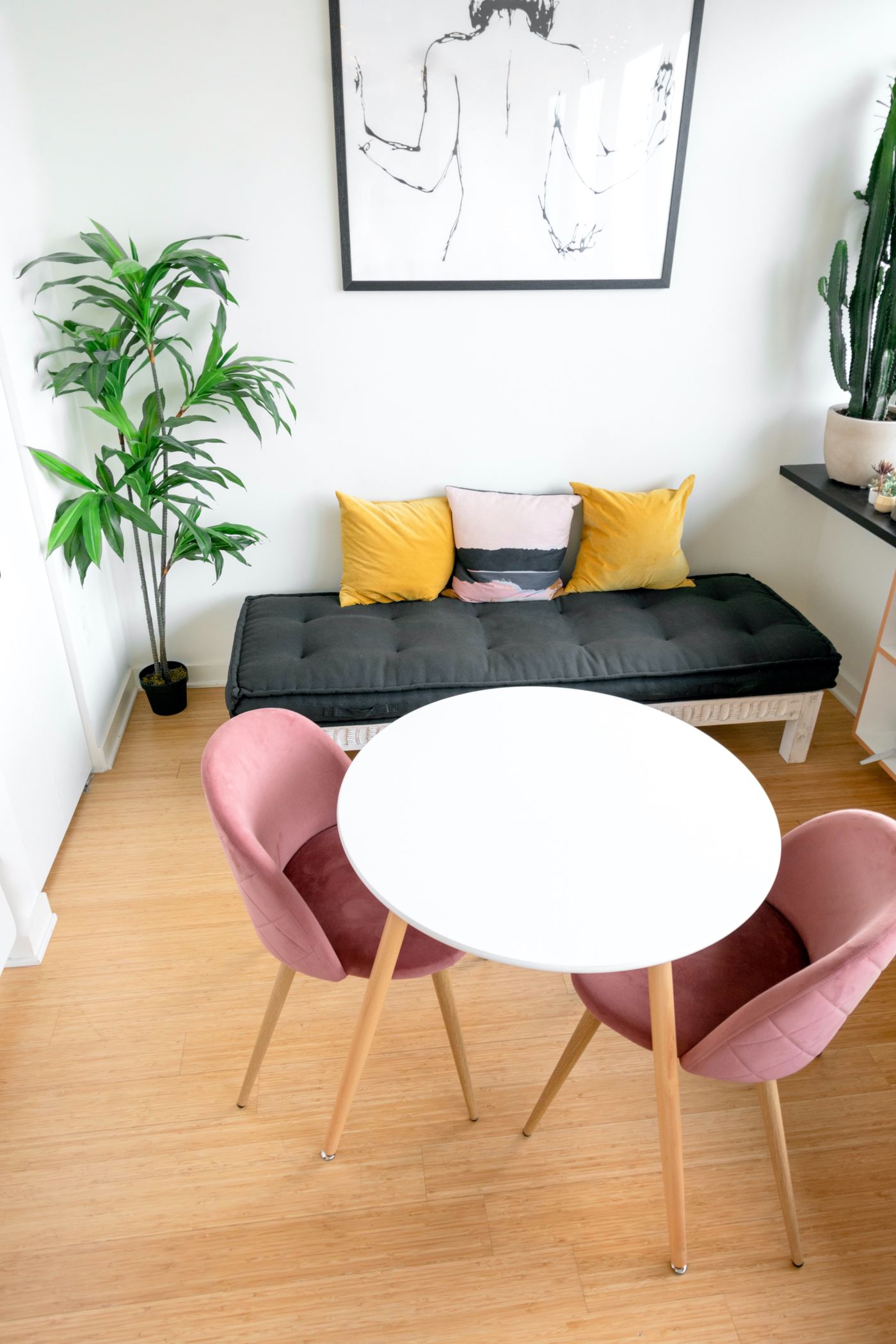 Ordinary chairs and a cushioned bench around a table