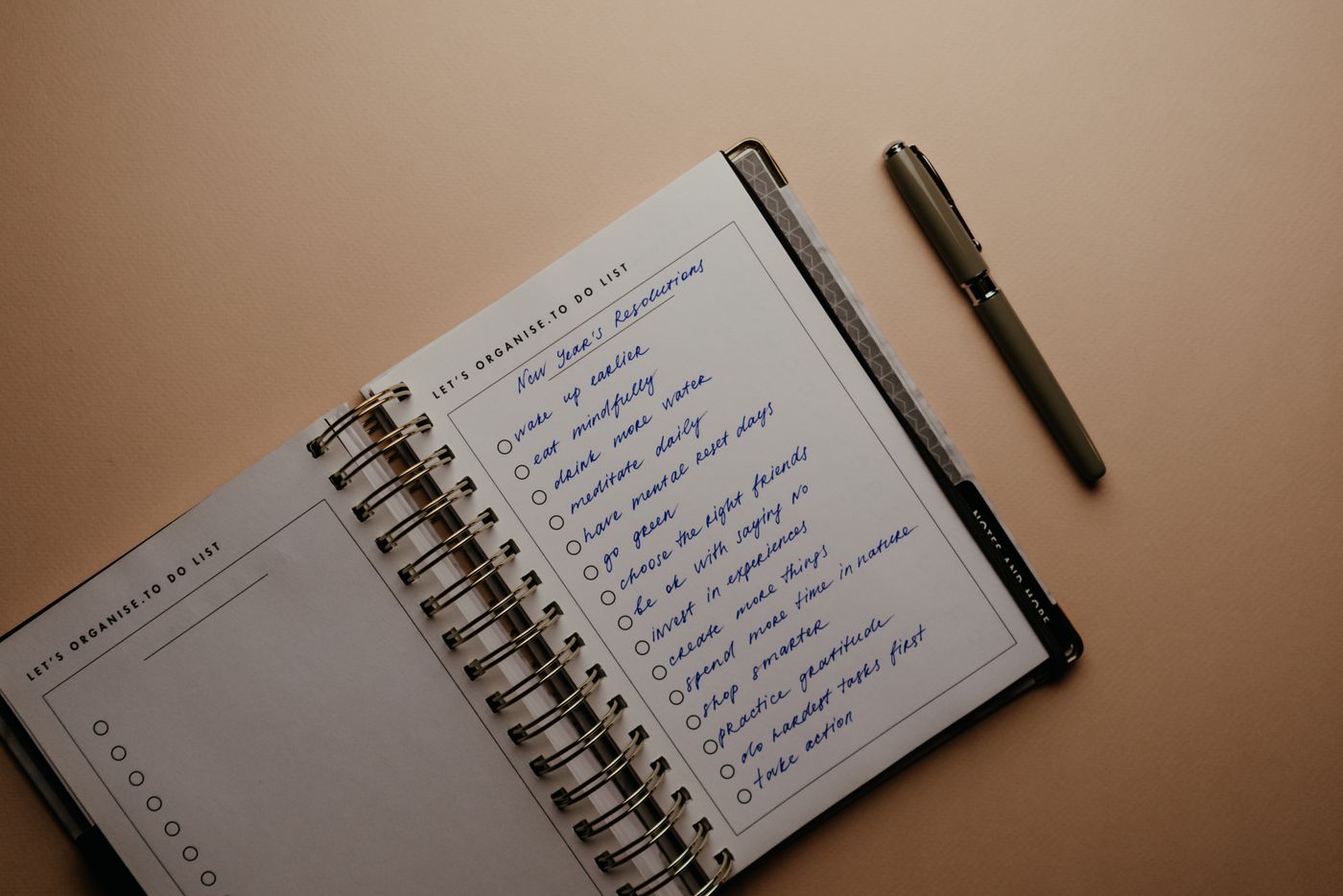 A handwritten page in a spiral notebook