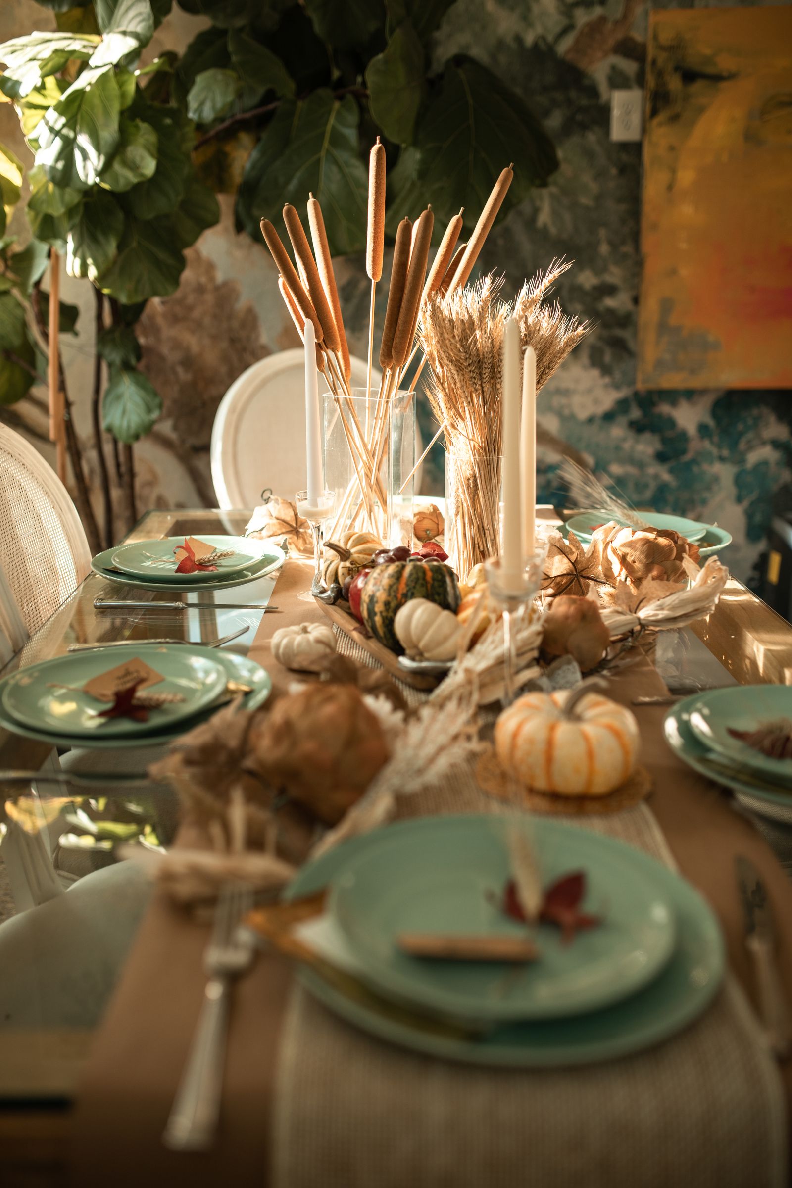 Autumn table setting with dishes and seasonal decorations
