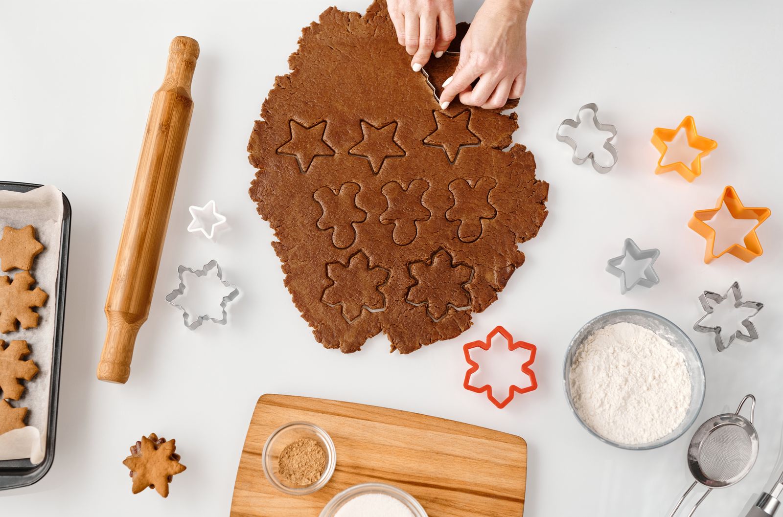 Cutters and dough arranged on a kitchen preparation surface