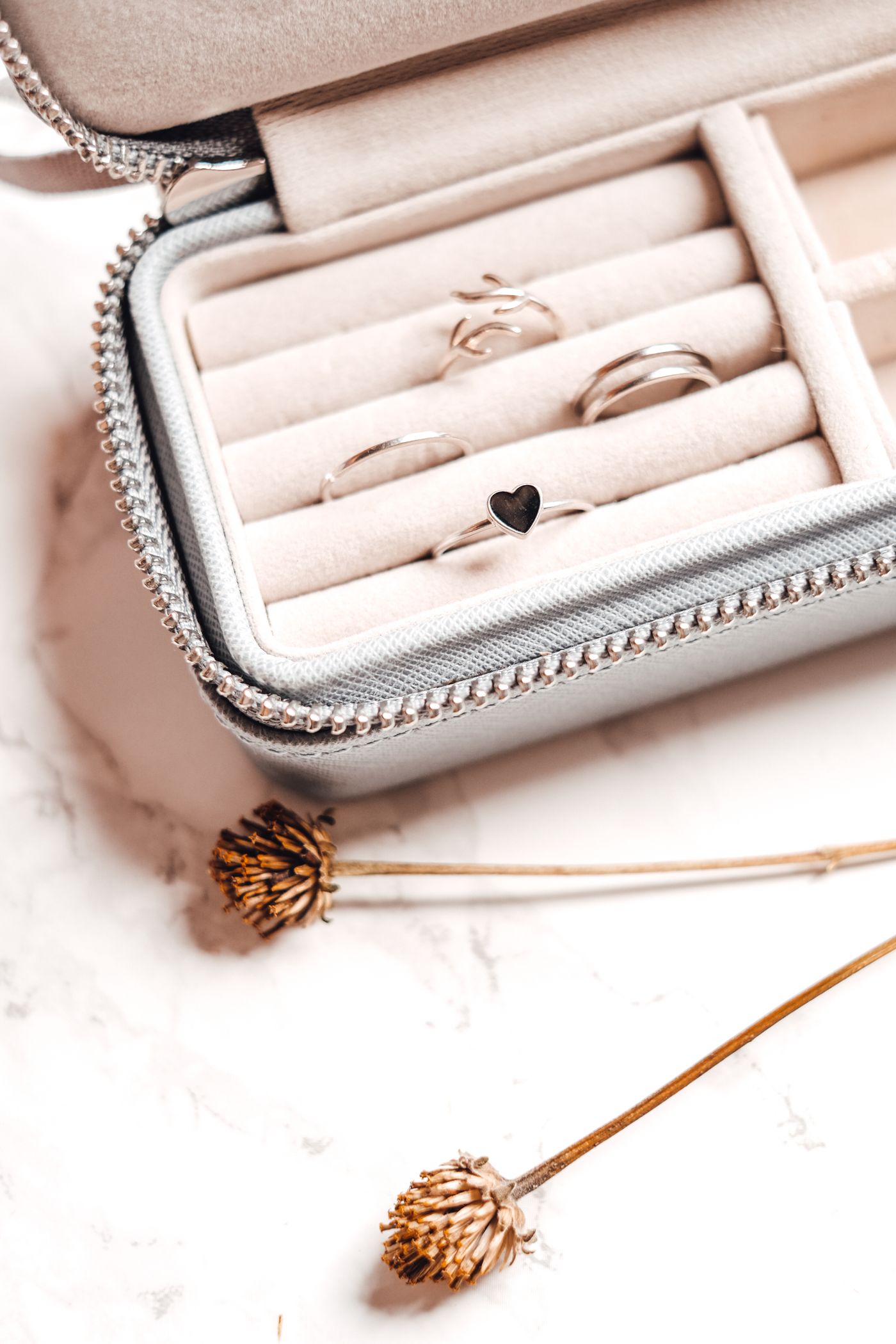 Small zippered jewelry case with divided ring storage