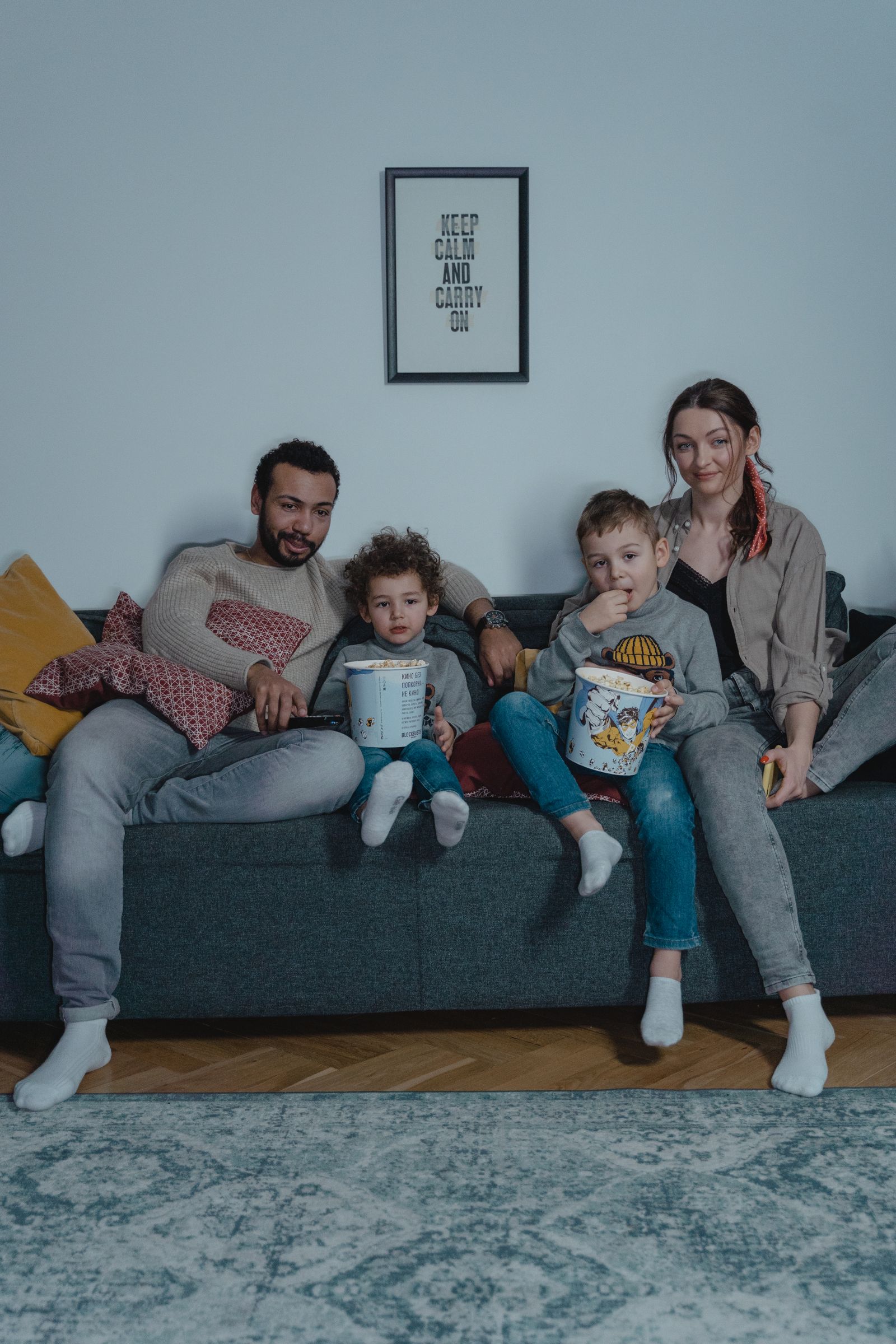 A family watching together from a sofa