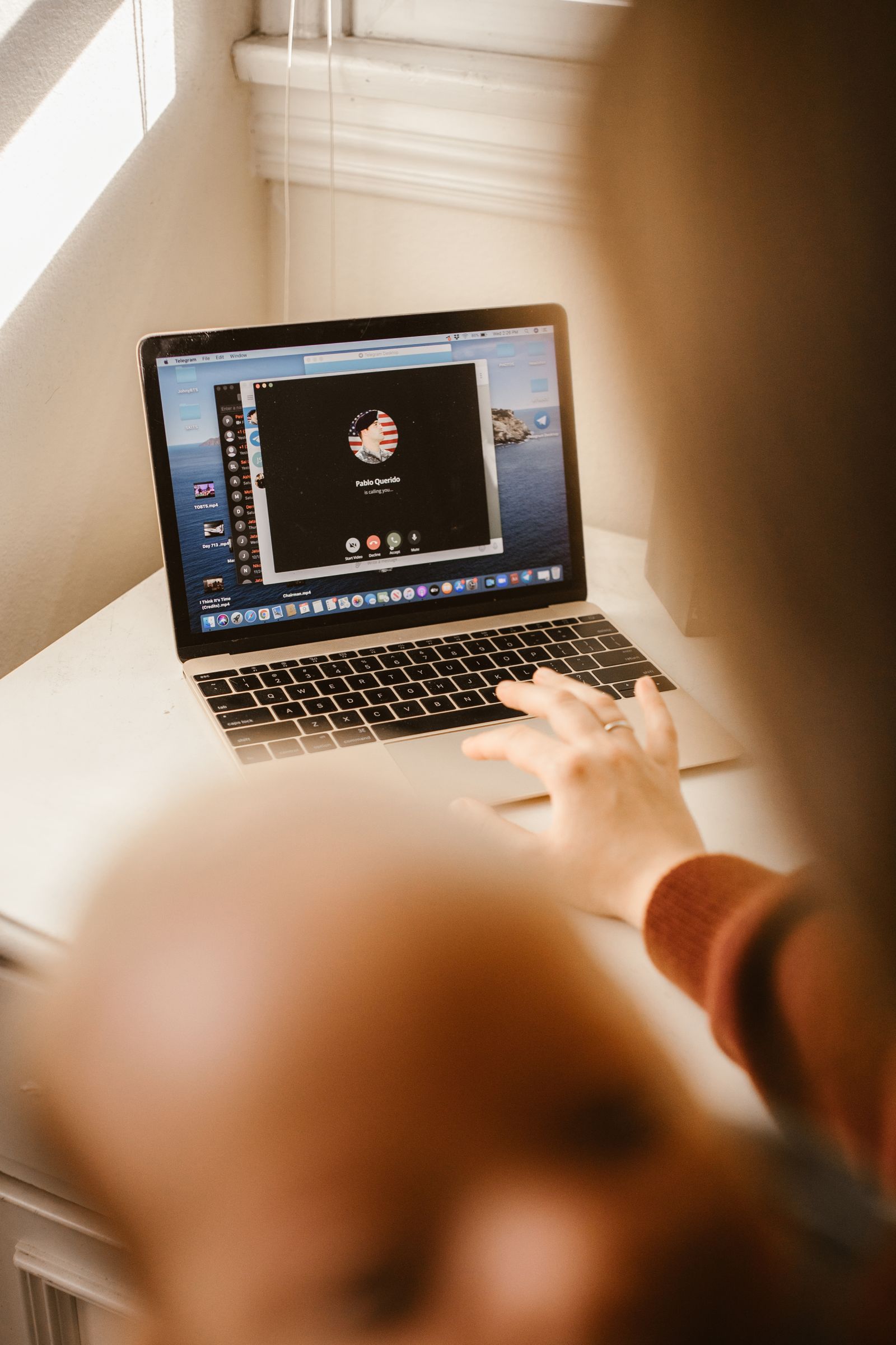 A laptop screen showing a video-call interface