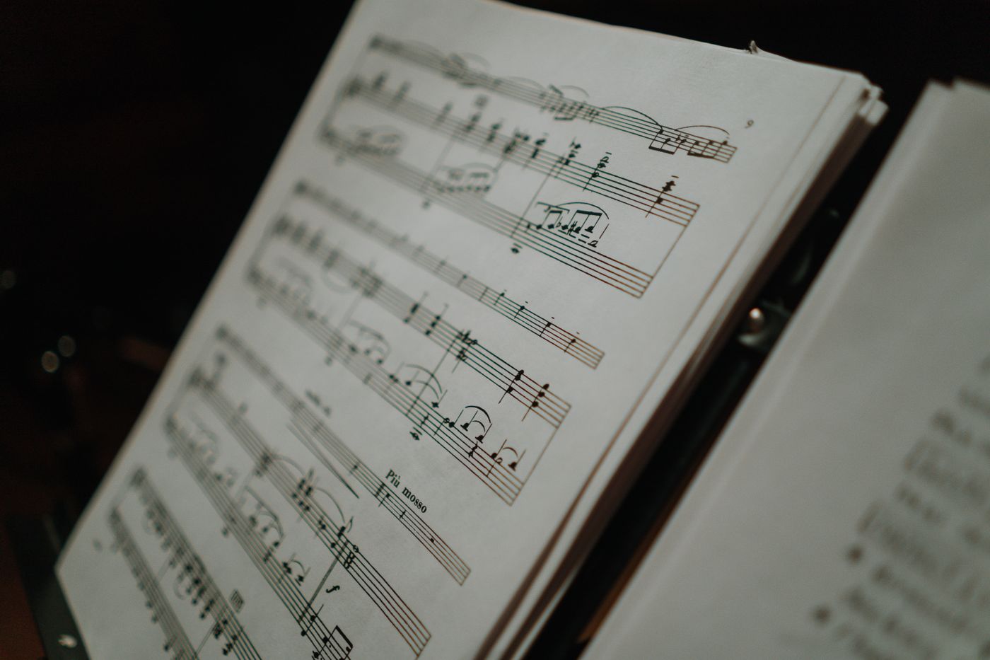 Printed score open against a dark background