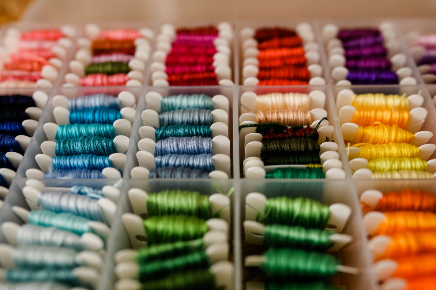 Embroidery threads wound on separate storage cards