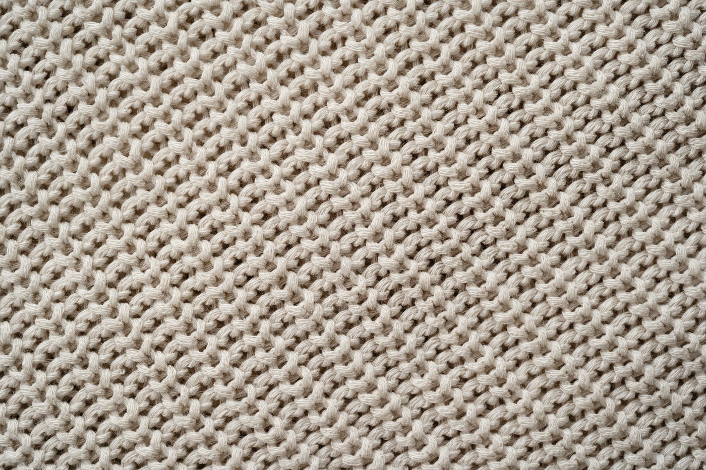 Close-up of a light-colored knitted textile