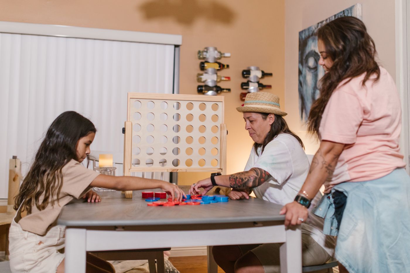 Family gathered at a table for a game