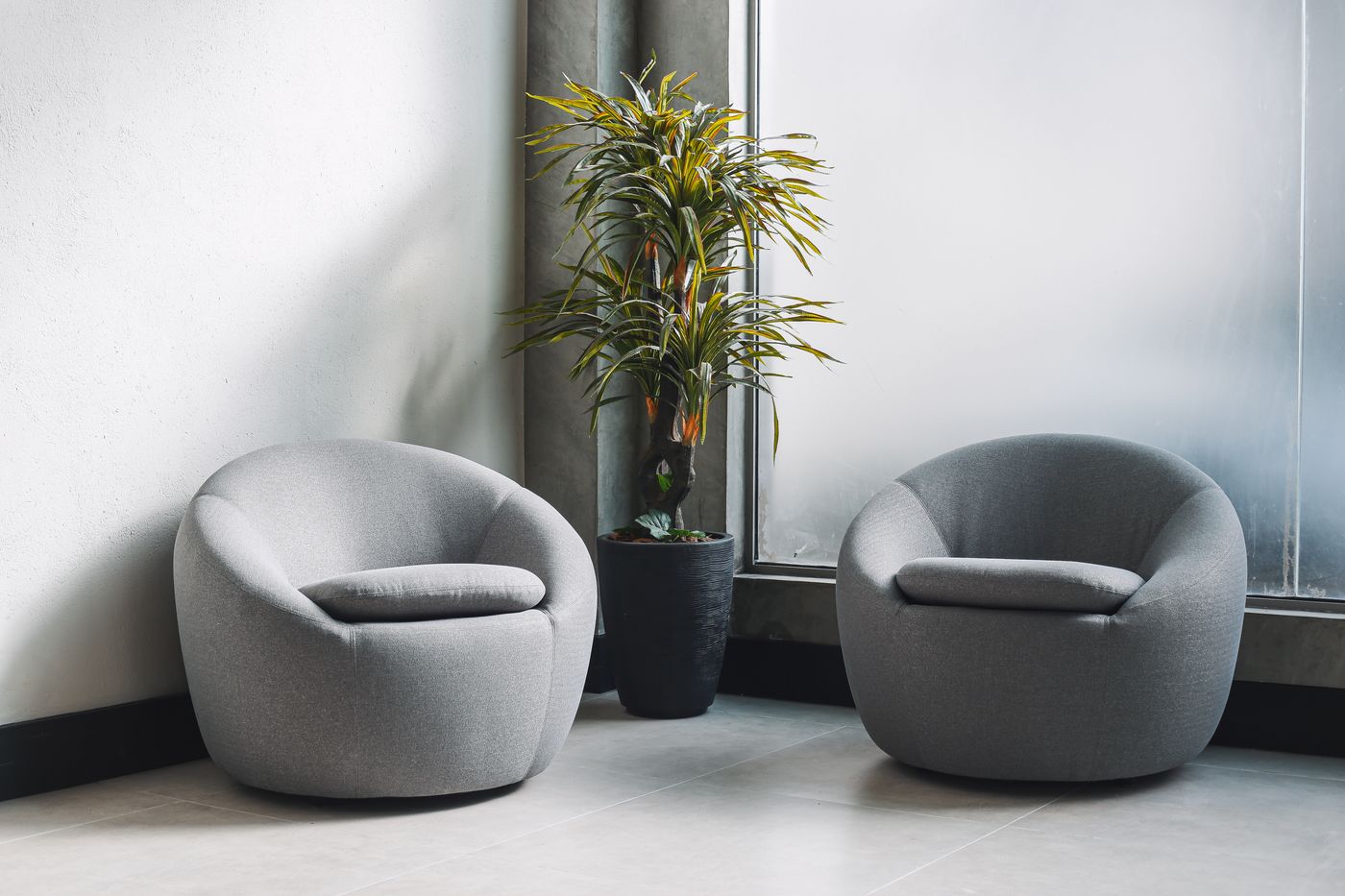 Pair of rounded chairs with open space around them